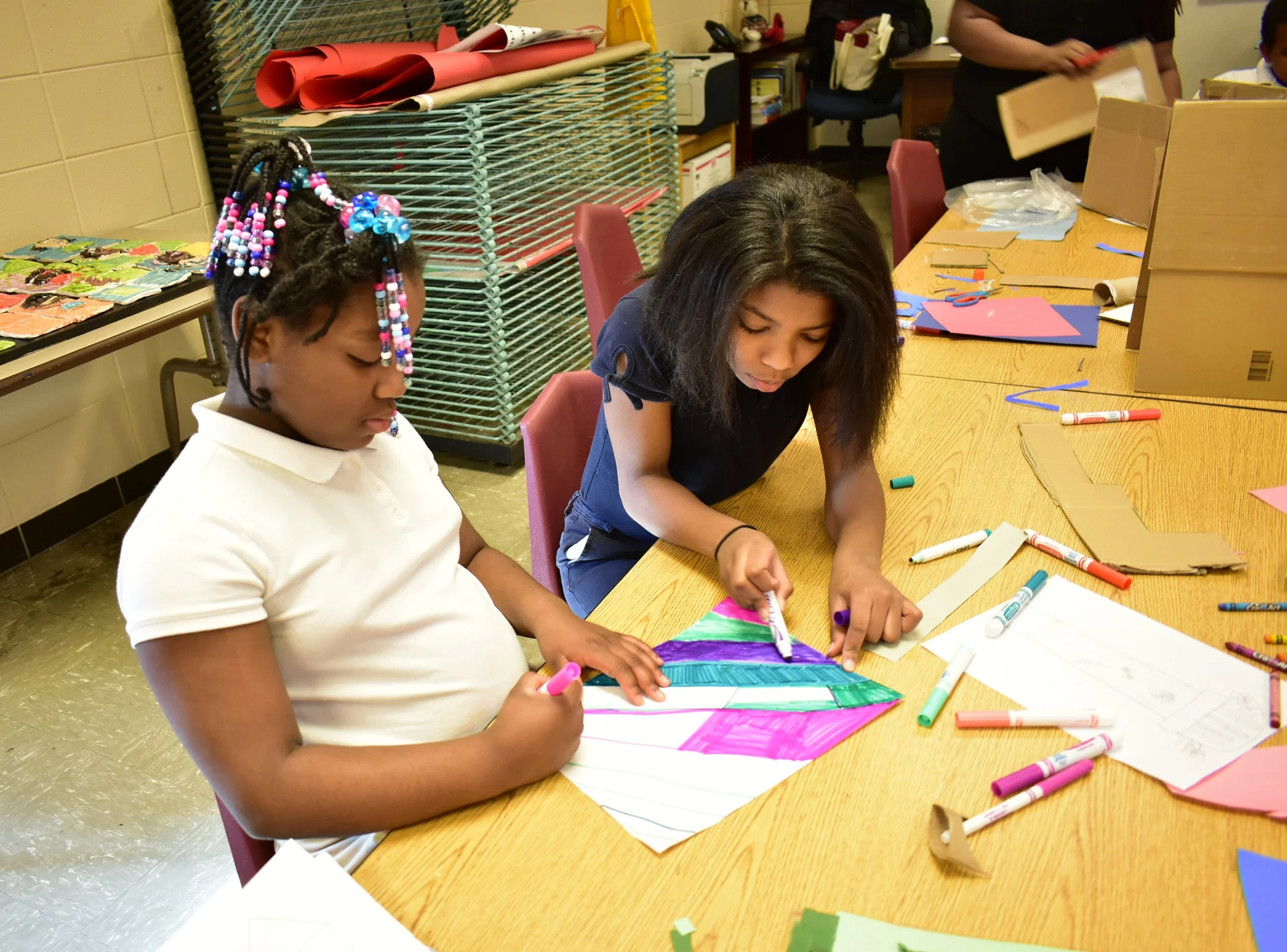 Fourth graders at Price Elementary are collaborating in small groups to design and construct their own unique Water Towers. This is the first day of construction - recycled materials, art supplies, a lot of imagination, and trial and error make for a fun and different learning experience. The project is sponsored by the Water Co. Foundation and the Fund for the Arts. The project also includes a field trip to the Water Works Museum and a Family Fun Day event at the Water Tower.