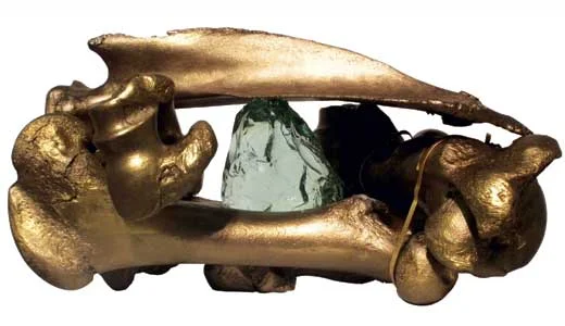 "Ancient Reliquary" by Ewing-Fahey, Gilded cattle bones and glass, 2011
