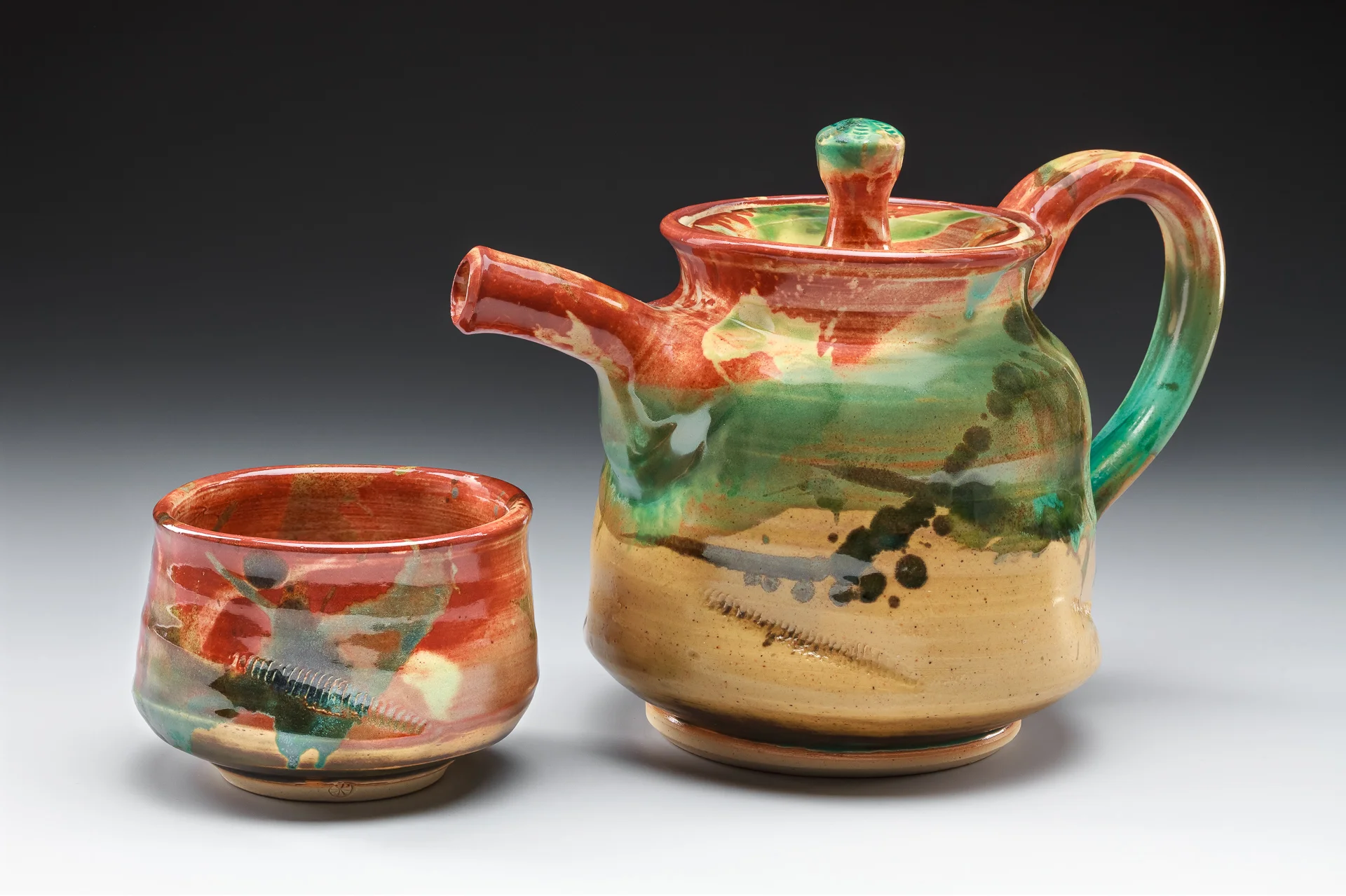 "Mountain Tea Set", by Lisa Kurtz, Stoneware, thrown and altered, Teapot: 7x9.5x5.5in, Teabowl: 2.75x4x4in, SOLD