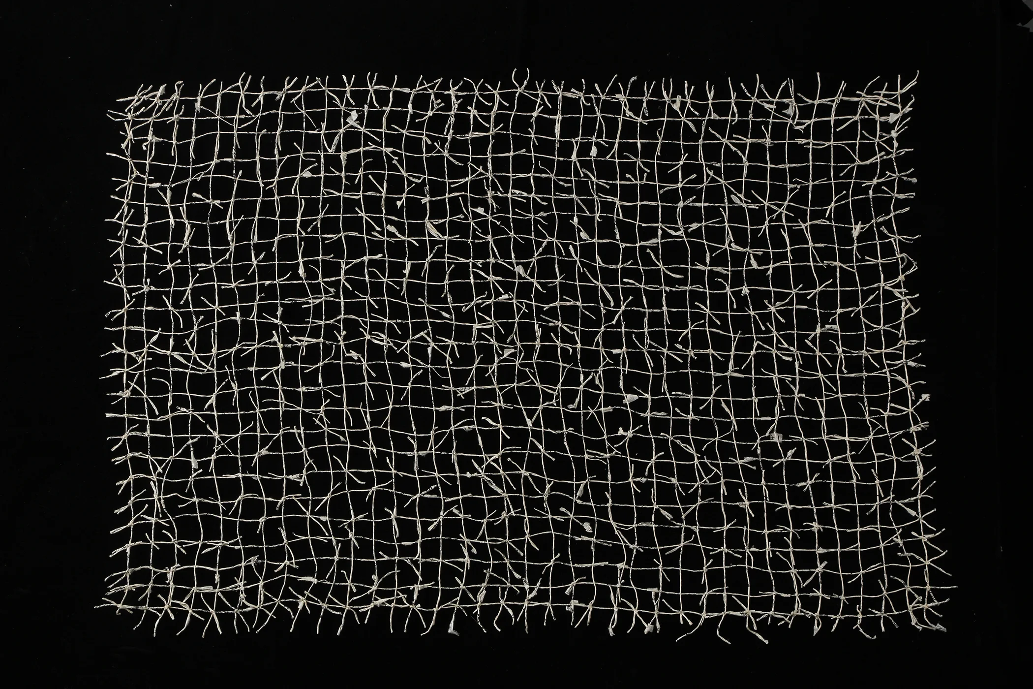 Spinning Out” by Bette Levy, Spun paper, Japanese ledger books, glue, 24x36in, 2019, $300