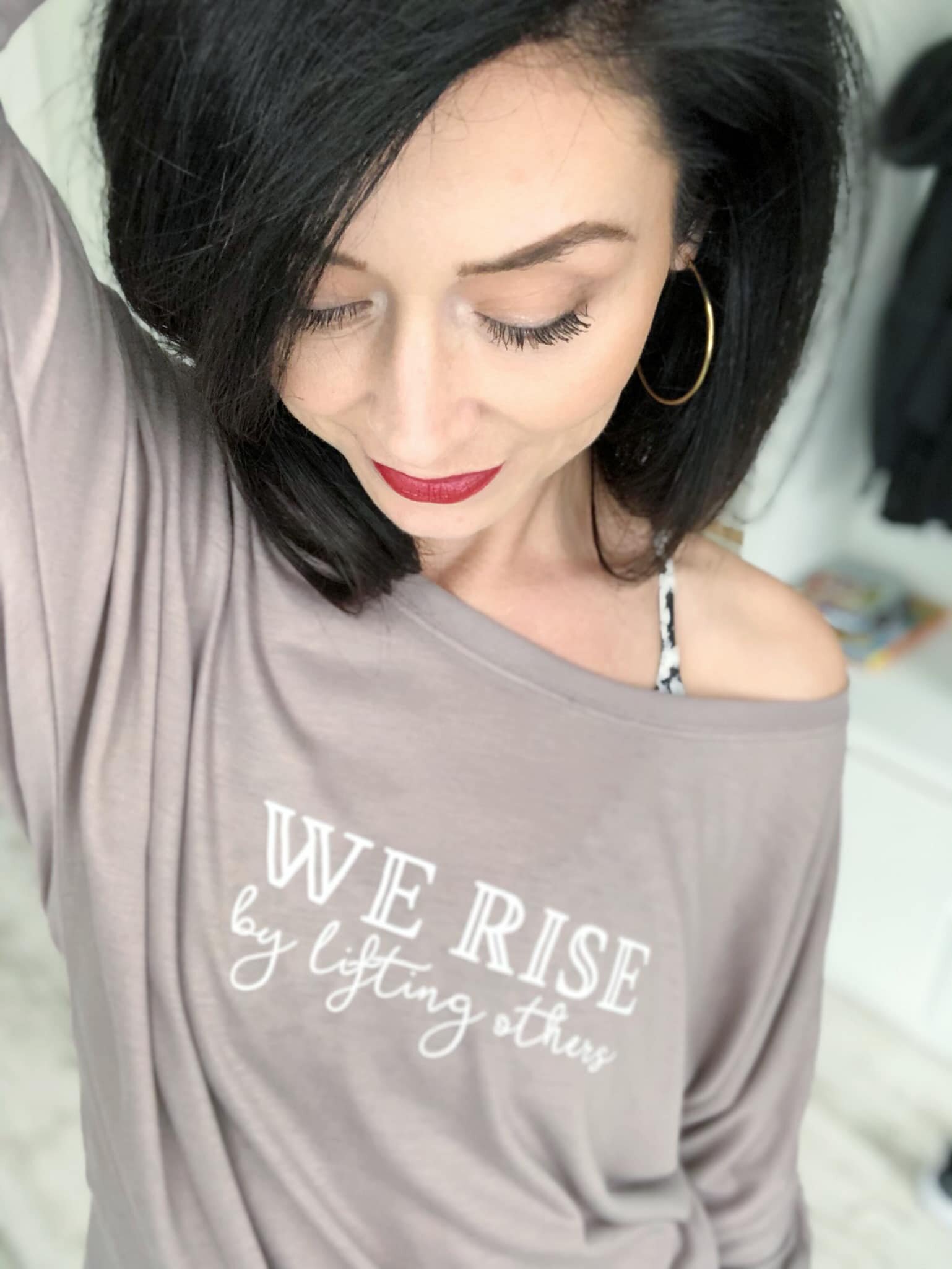 we-rise-by-lifting-others-graphic-tee.jpg