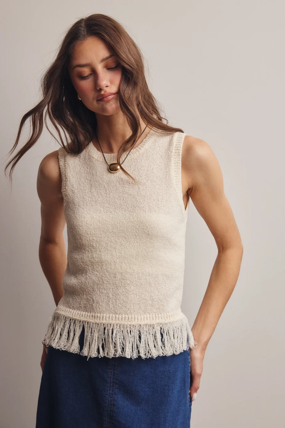 sleevless-fringe-knit-sweater.webp