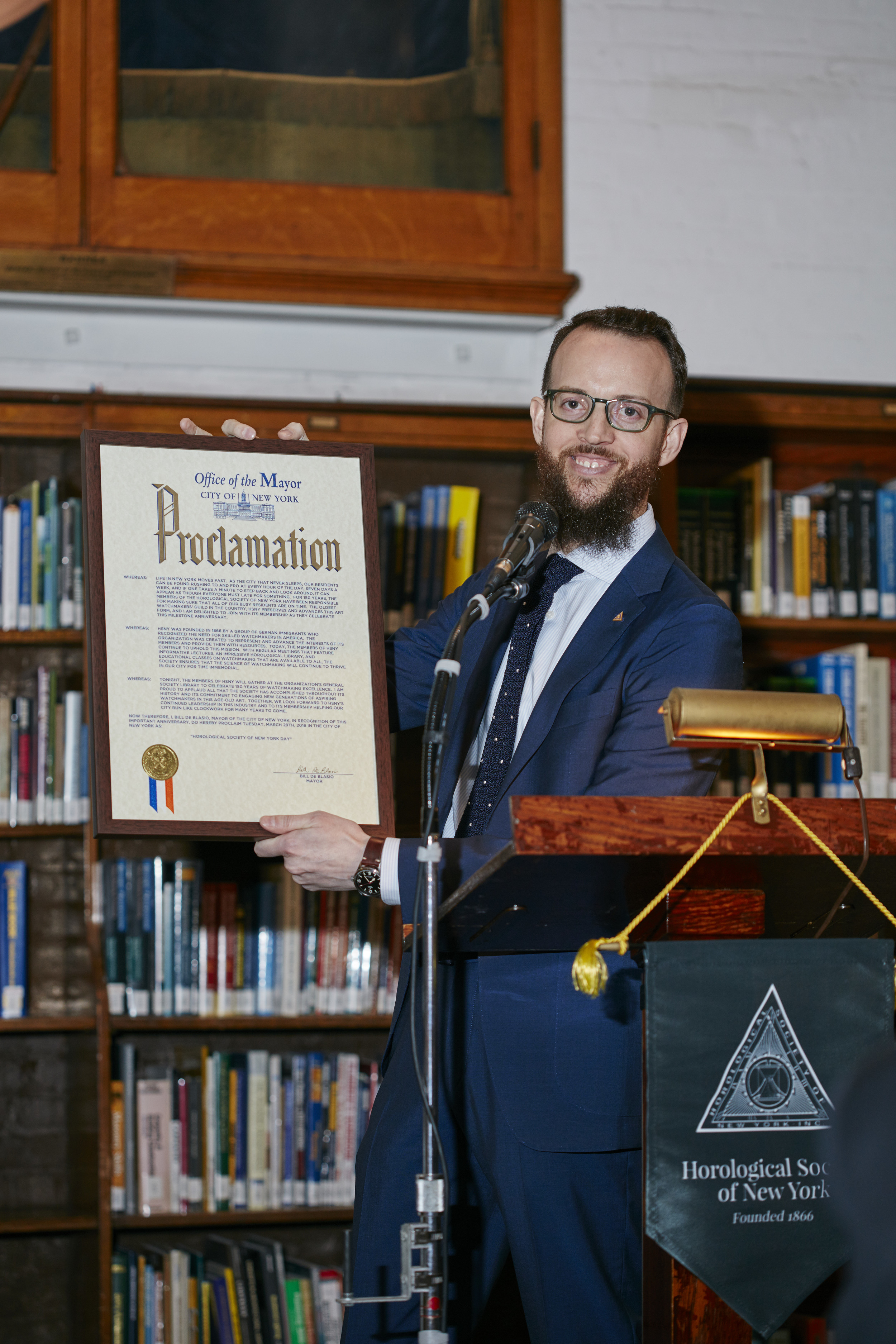   Nicholas Manousos, Vice President of HSNY,&nbsp;presenting a proclamation from New York City Mayor Bill de Blasio  