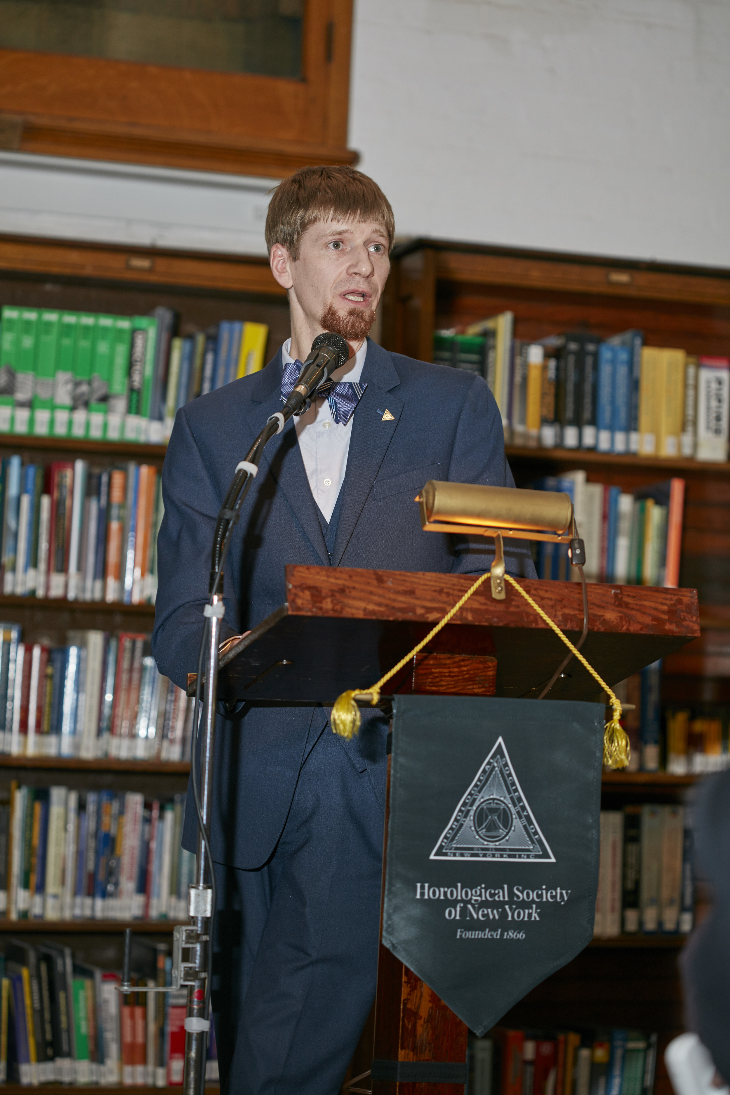  Jordan Ficklin, Executive Director of the American Watchmakers-Clockmakers Institute, speaking to the crowd 