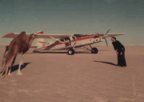 A young Urs encounters a camel in the Libyan desert while flying for the Italian oil firm Agip