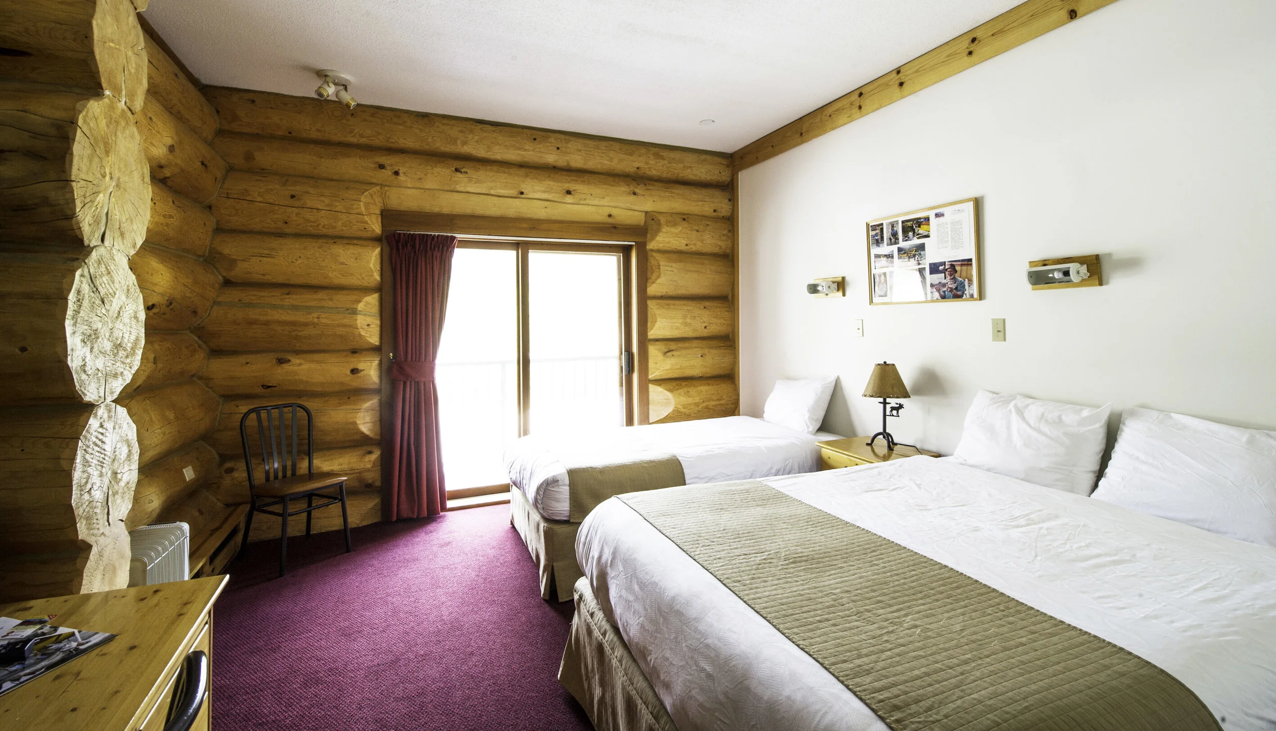 Hotel Rooms (Open year round) Our lodge rooms are designed in the log-cabin style. All rooms feature a 32" LCD TV with satellite, WIFI internet, modern full en-suite washroom with a bathtub & shower, and a hairdryer.