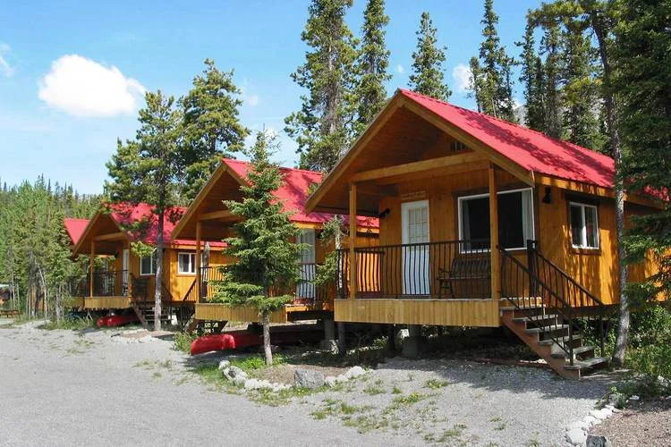 Lakeshore Chalets Our most luxurious, spacious cabins, featuring west facing views of Muncho Lake. Relax on your own balcony and take in panoramic views of the Northern Rocky Mountains. Inside are 2 queen beds, breakfast nook, coffee maker, bar fridge, WIFI internet, standard TV, modern bathroom with tub & shower, and a hairdryer. Stay 3 nights or more and enjoy a free canoe rental.