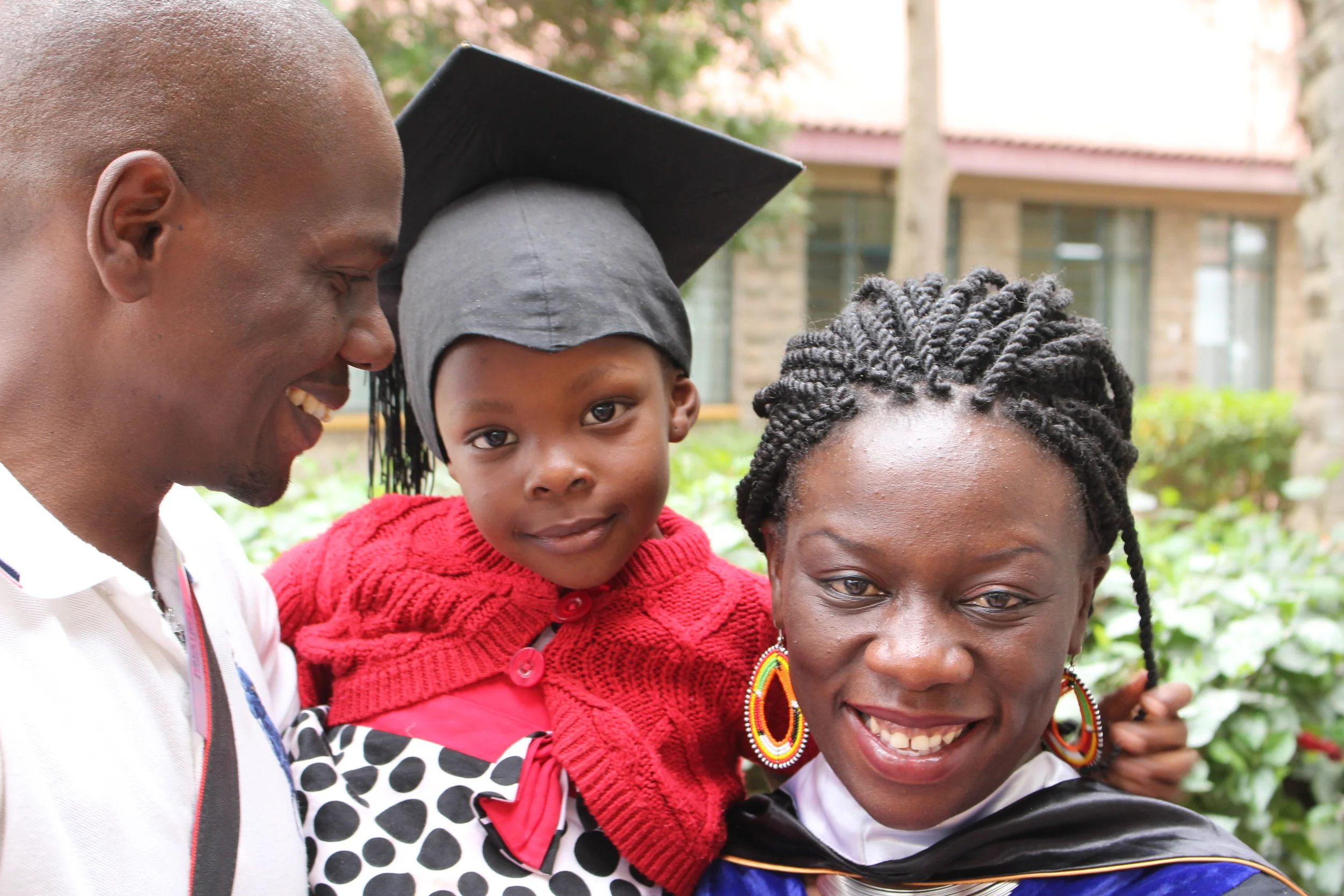 Eric, his daughter, Ariella, and wife, Winnie at Winnie's graduation in 2015.