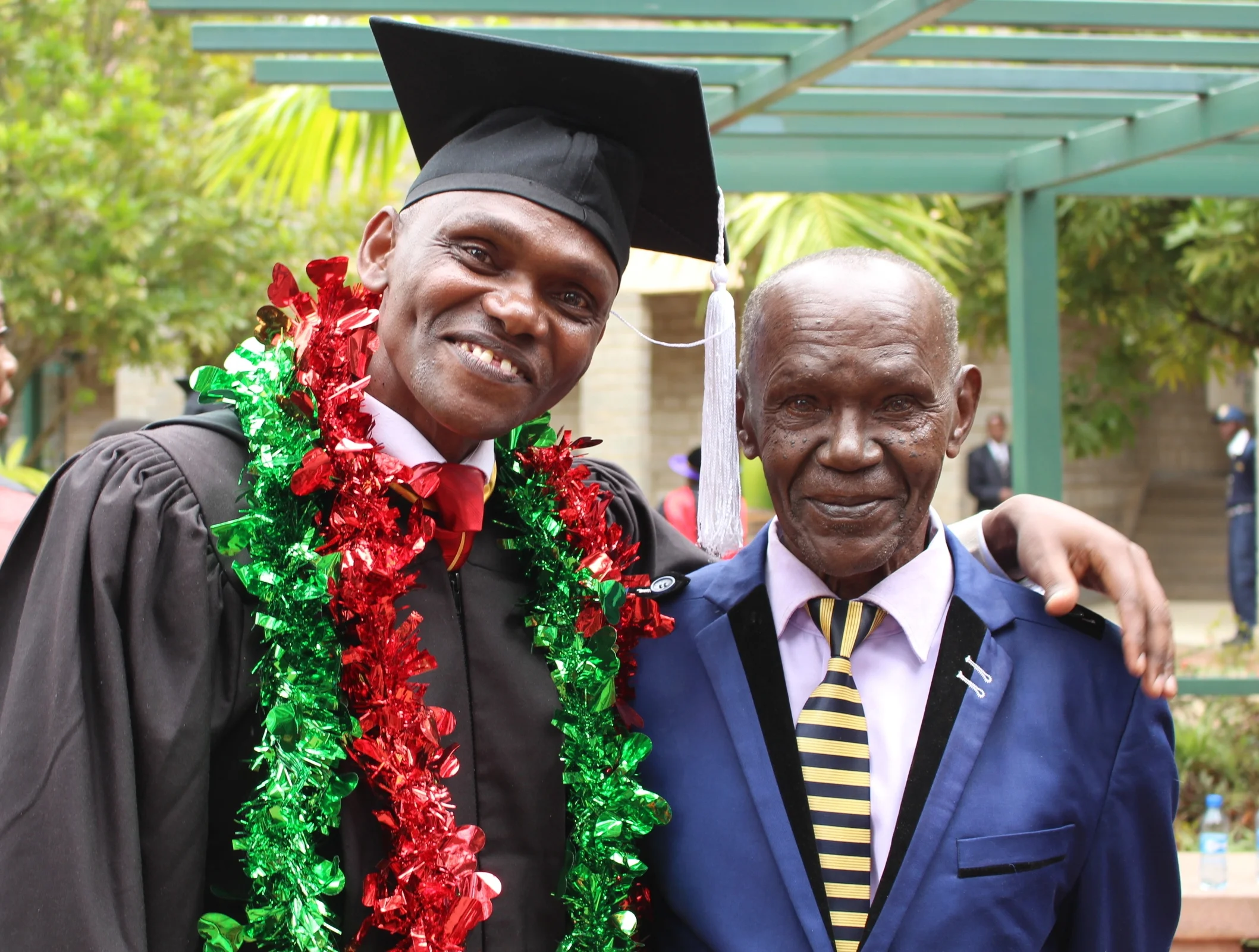 James, pictured with his father, graduated this June.