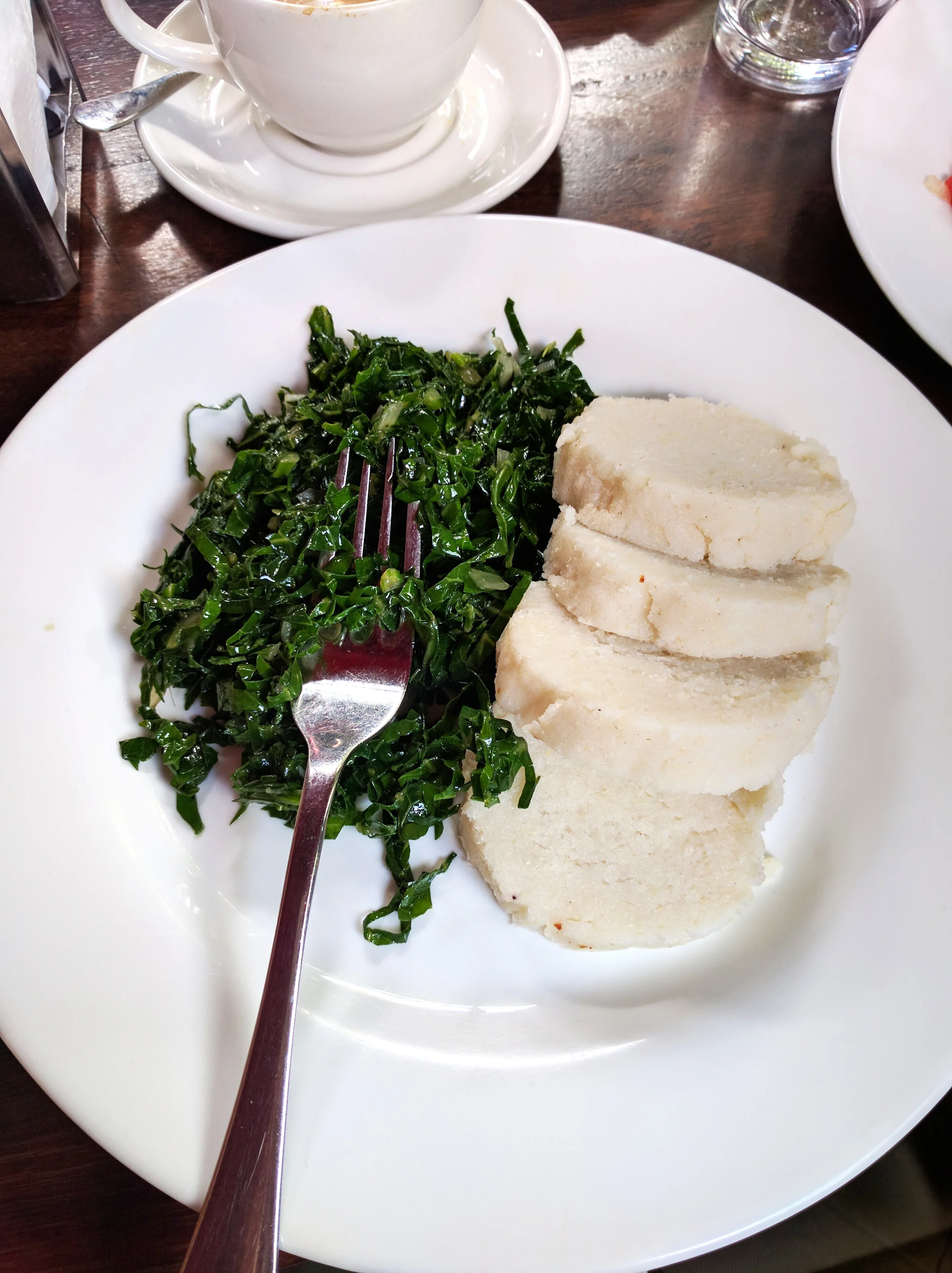 We tried some traditional Kenyan food: ugali, a dish made of cornmeal cooked in boiling liquid to a dough-like consistency, and sukuma wiki, a kale-like green.