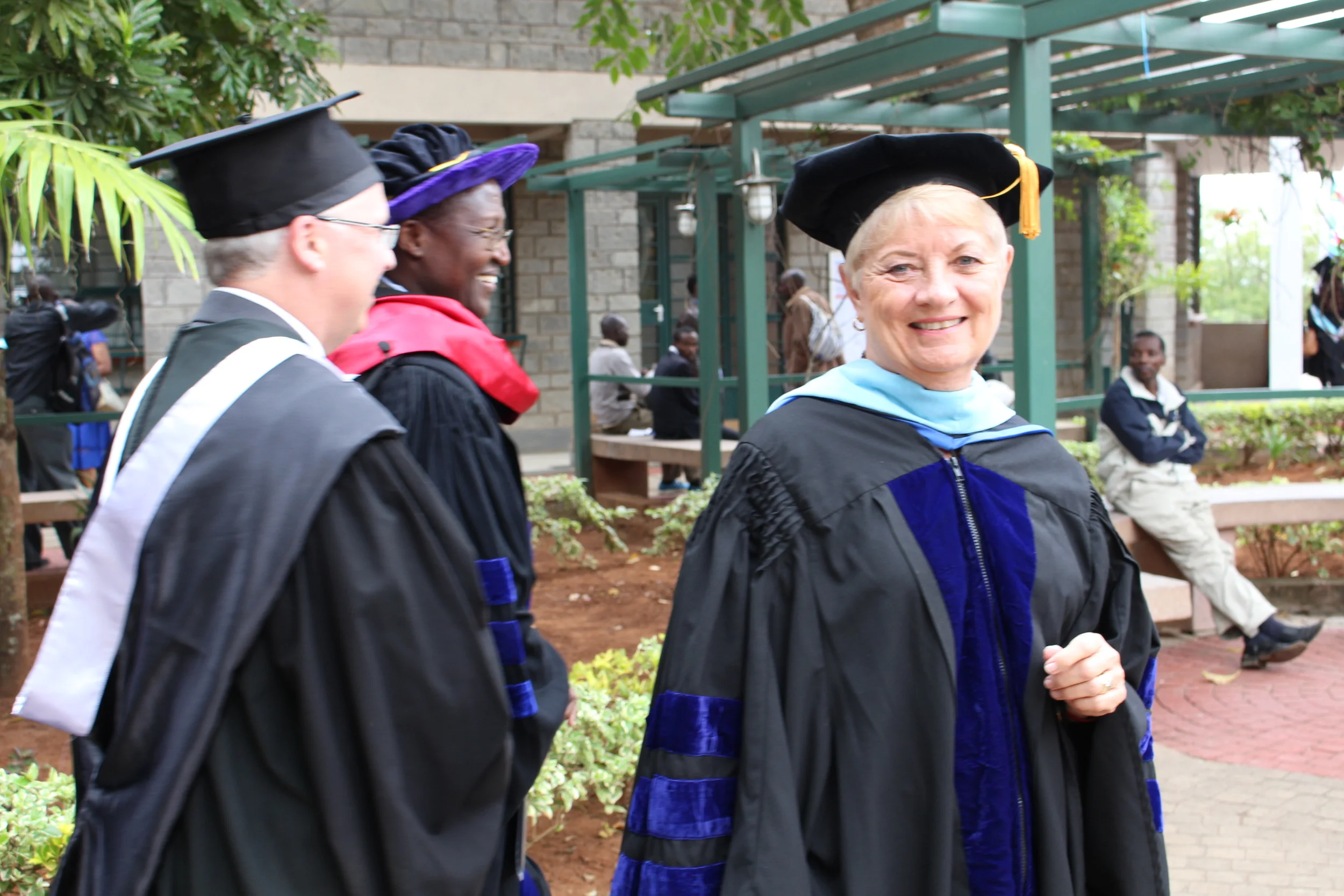 Kathy walking in the faculty and academic procession at Daystar's graduation ceremony in June 2016.