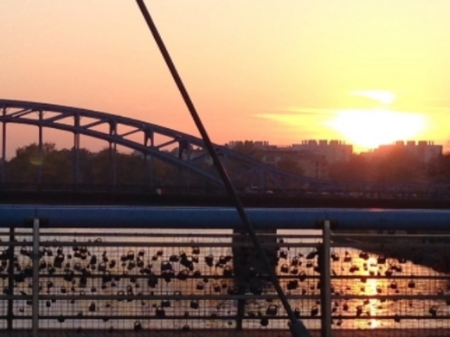 Kraków Poland_sunset Vistula river with key locks as sign of love on bridge .JPG