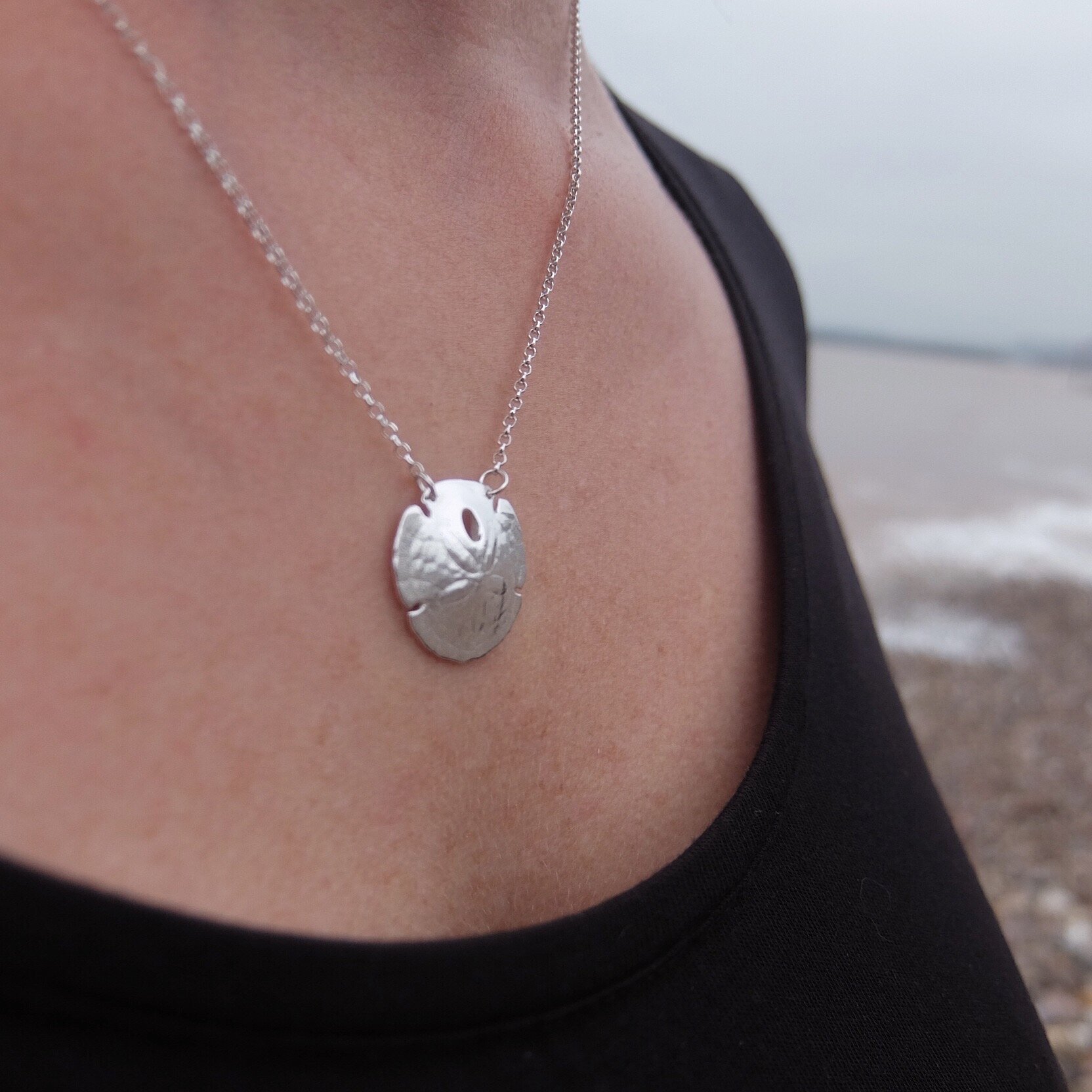 silver sand dollar necklace sterling silver pendant beach ocean sea inspired jewellery jewelry made in uk devon cornwall contemporary jeweller jasmine bowden shell surf bespoke 7.jpg
