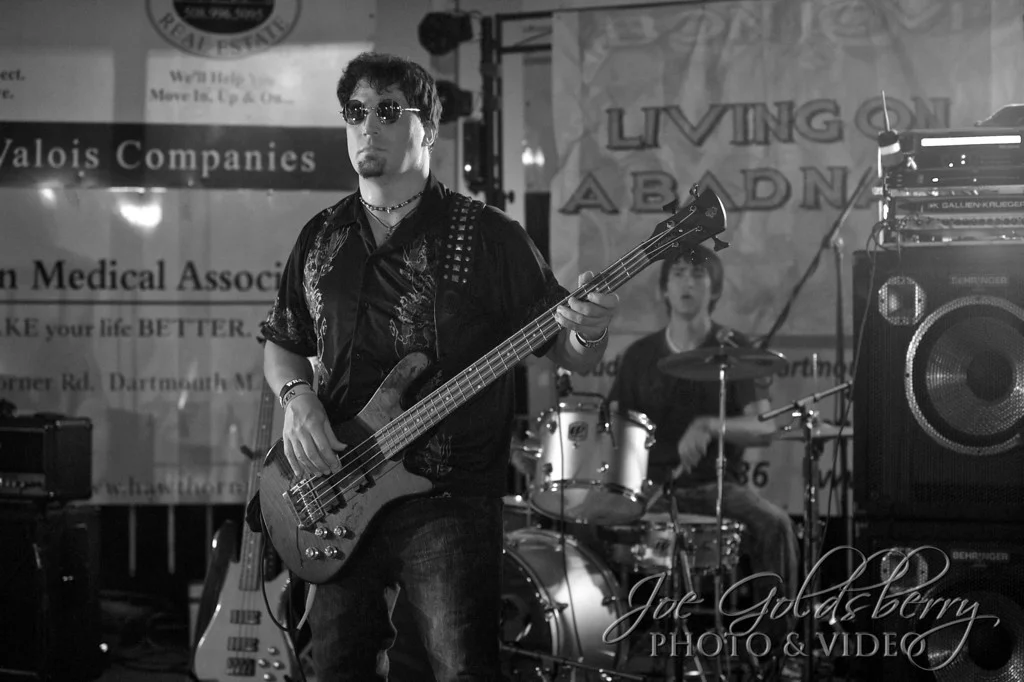 Bon Jovi tribute band Living on a Bad Name bassist John Miker, with drummer Keith Pittman in the background.