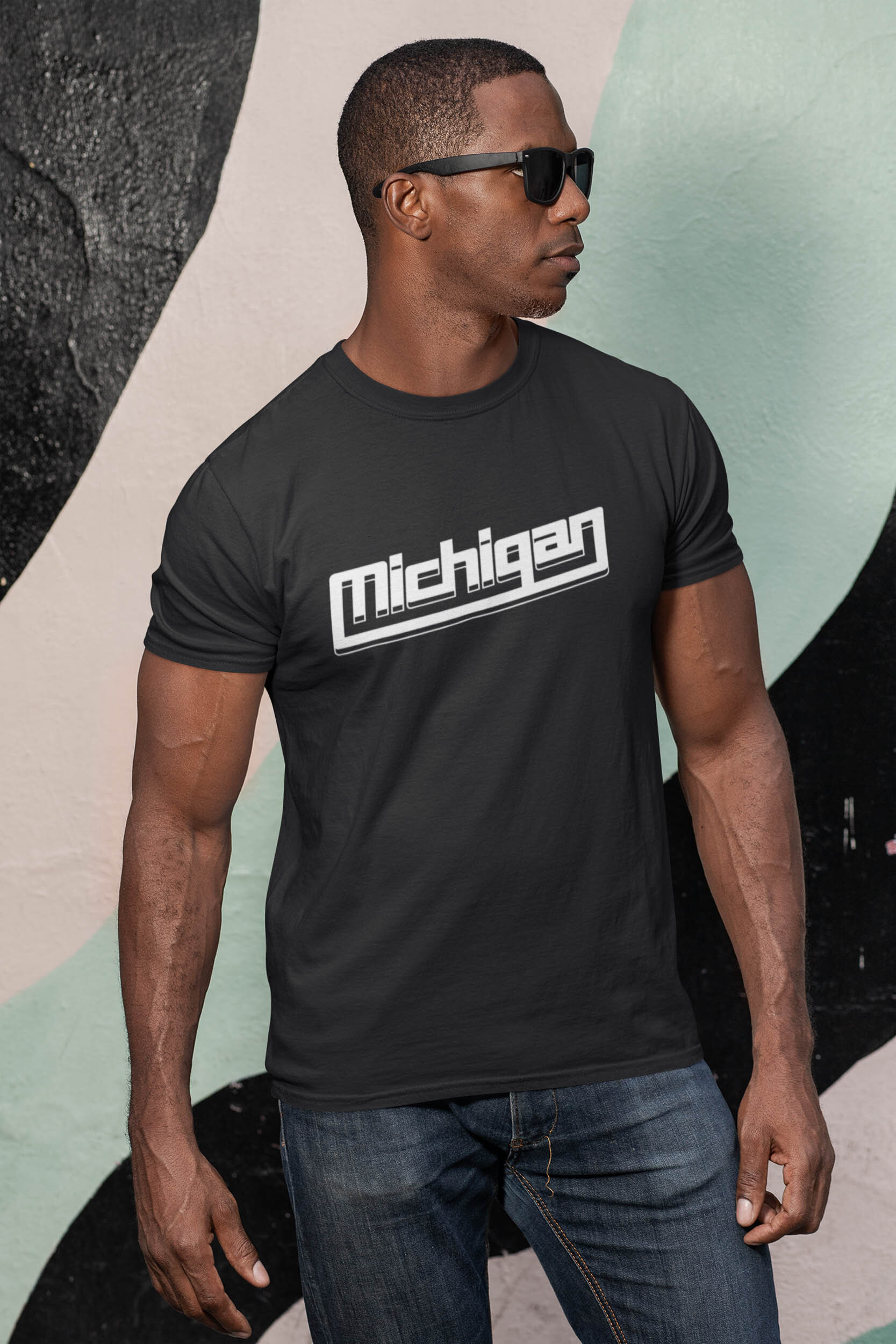 mockup-of-a-man-with-sunglasses-wearing-a-customizable-t-shirt-against-a-painted-wall-30447.jpg