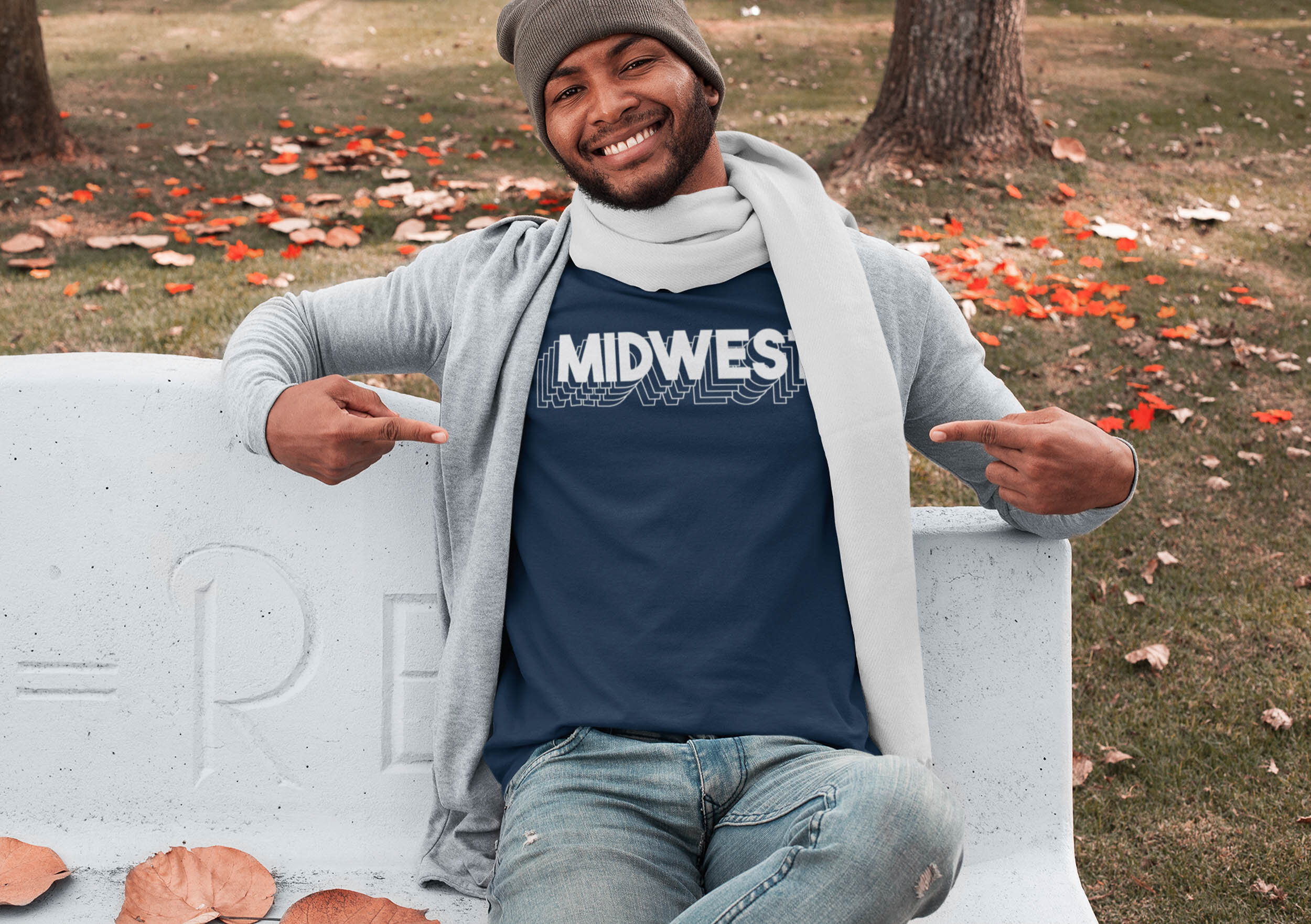 t-shirt-mockup-featuring-a-man-sitting-on-a-concrete-bench-at-a-park-in-autumn-30284.jpg
