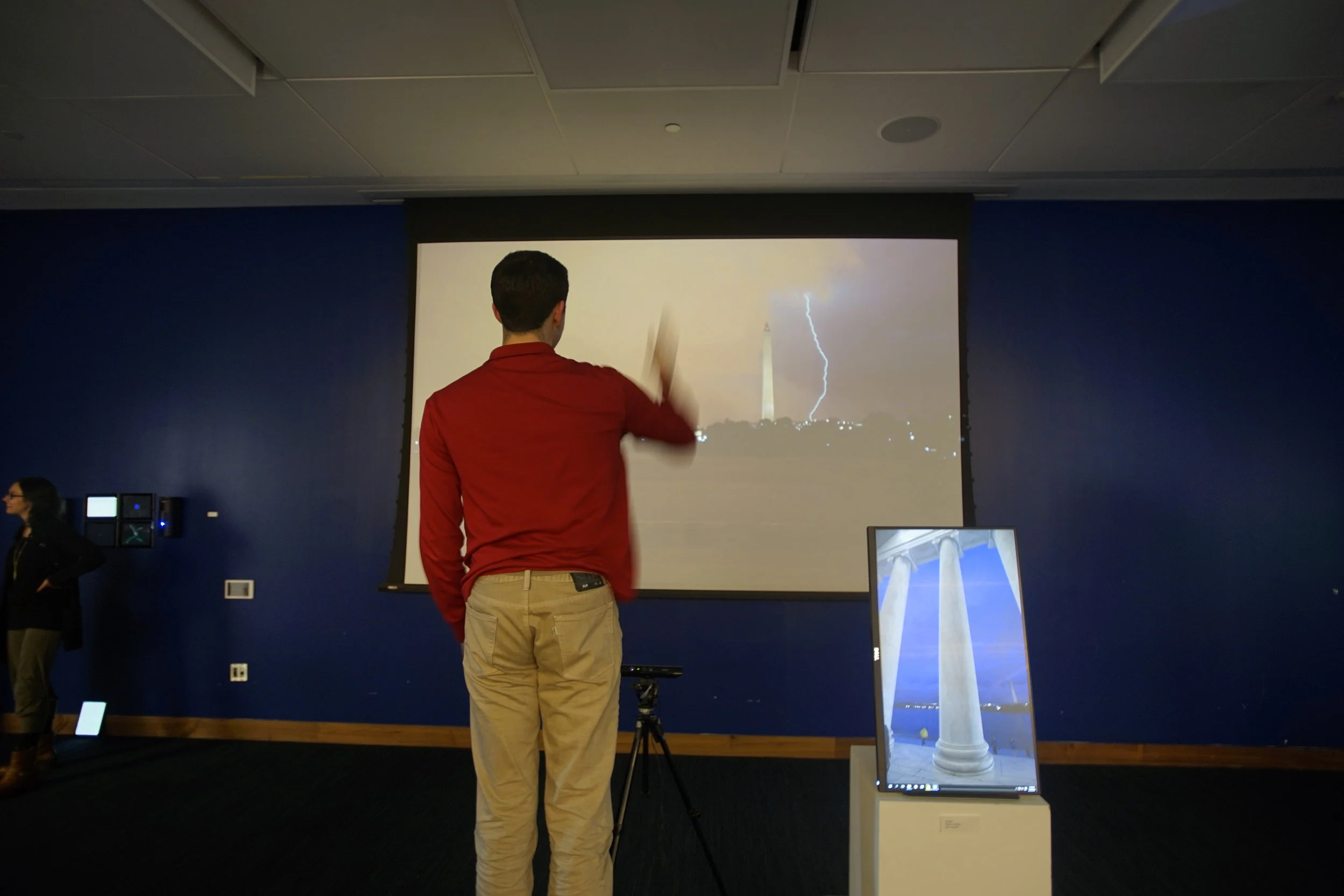 NATHAN DANSKEY - CONJURE Interactive installation. As participants moved their arms up and down, motion-detecting software in Conjure would be triggered and lightning appeared on the screen next to the Washington Monument. This was real footage of a summer D.C. storm. 