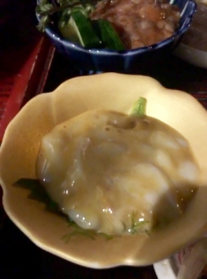 I think this is a type of squid and the maguro is in the bg.
