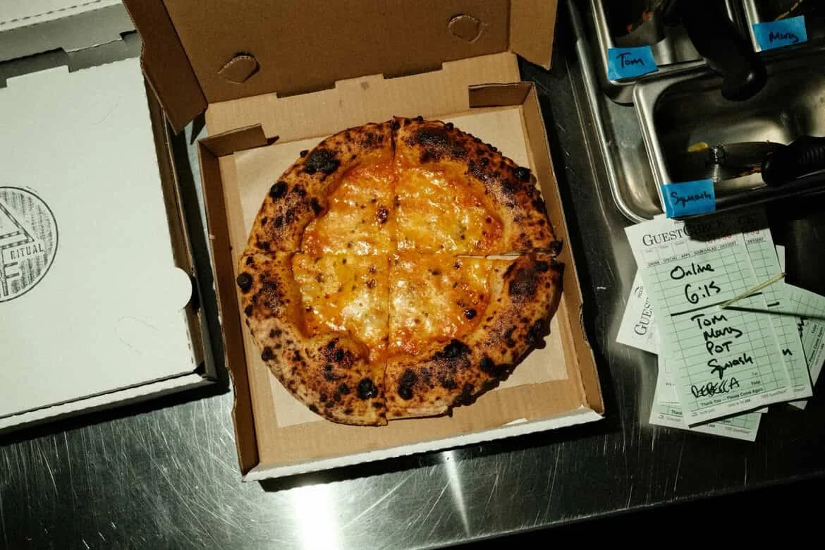 personal size cheese pizza in a box on a counter