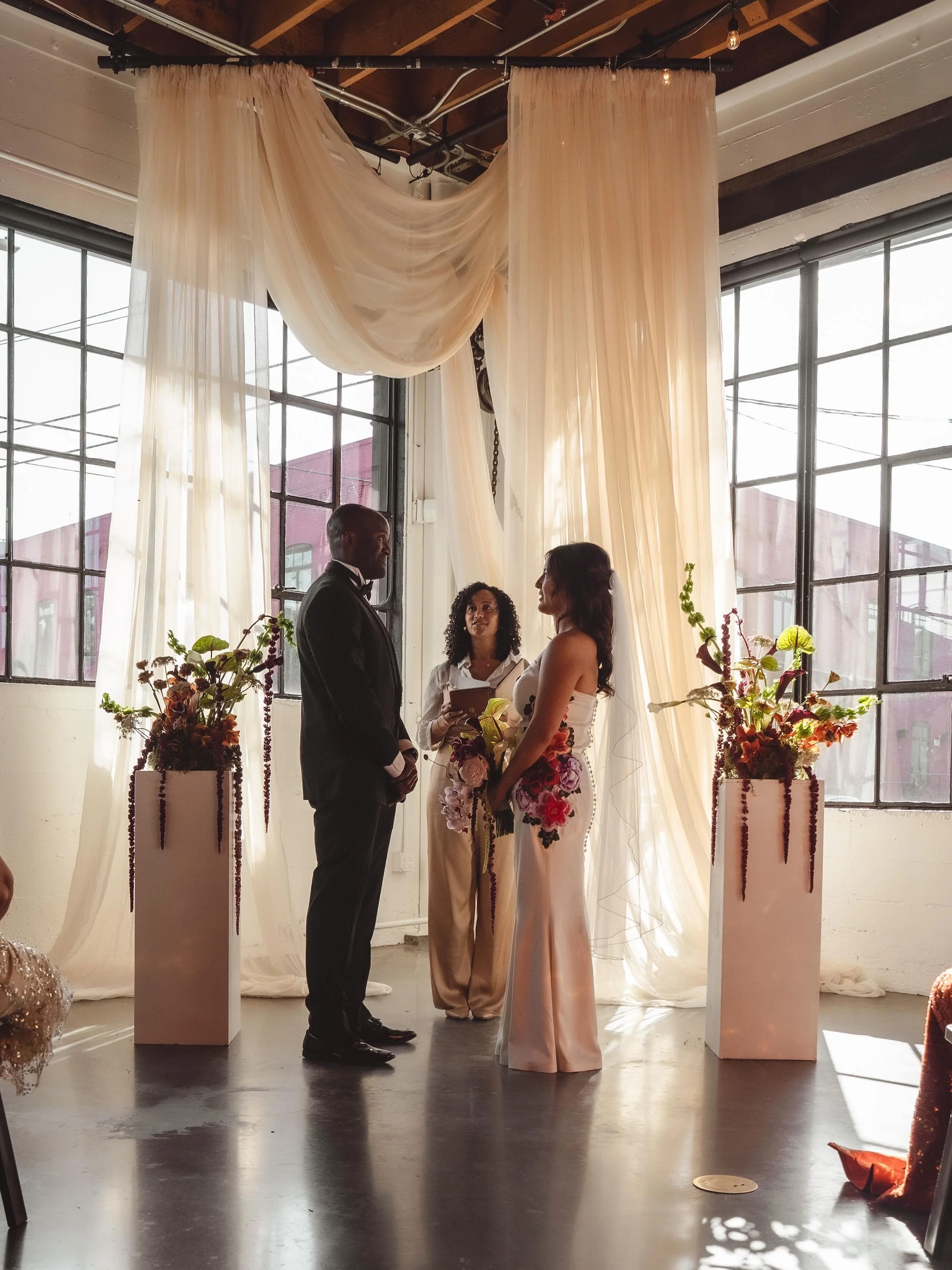 Beautiful wedding backdrop  Venue- @castawayportland 
Photographer- @theloveclub_pnw 
Floral- @darling_dahlia_floral 
Catering- @deemetanaijacuisine + @tamaleboypdx 
Bartending and Waitstaff- @meritbadgeco 
Desserts @voodoodoughnut 
Officiant @anothe
