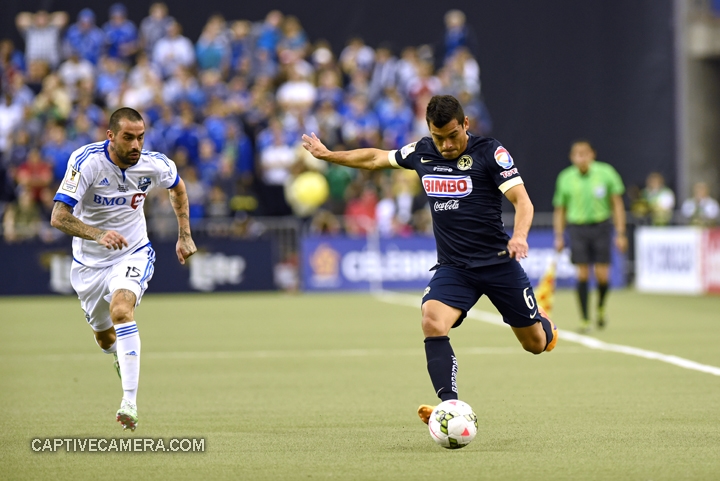    Montreal, Canada - April 29, 2015: Andres Romero #15 of Montreal Impact chases down Miguel Samudio #6 of Club America.    &nbsp;   