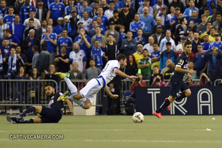   Montreal, Canada - April 29, 2015: Ignacio Piatti #10 of Montreal Impact is fouled by Jose Guerrero #21 of Club America.  