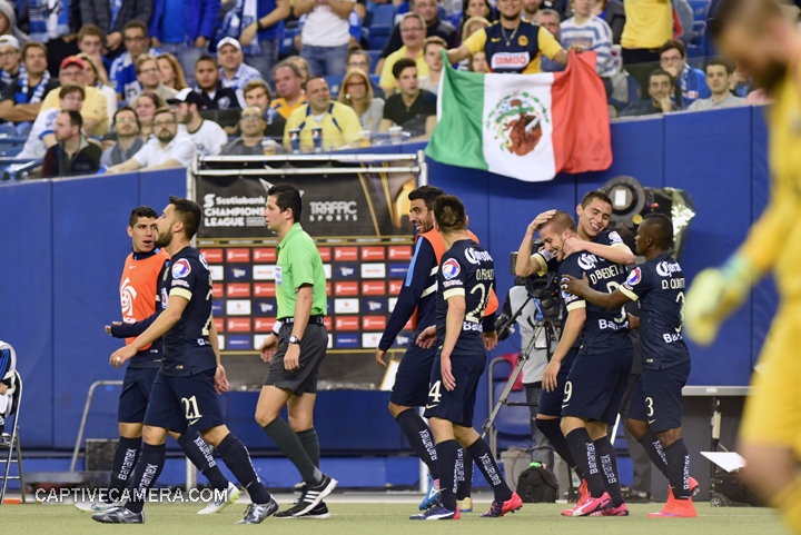   Montreal, Canada - April 29, 2015: Club America players celebrate Dario Benedetto's hat trick while Montreal Impact goalie Kristian Nicht is unsettled.  