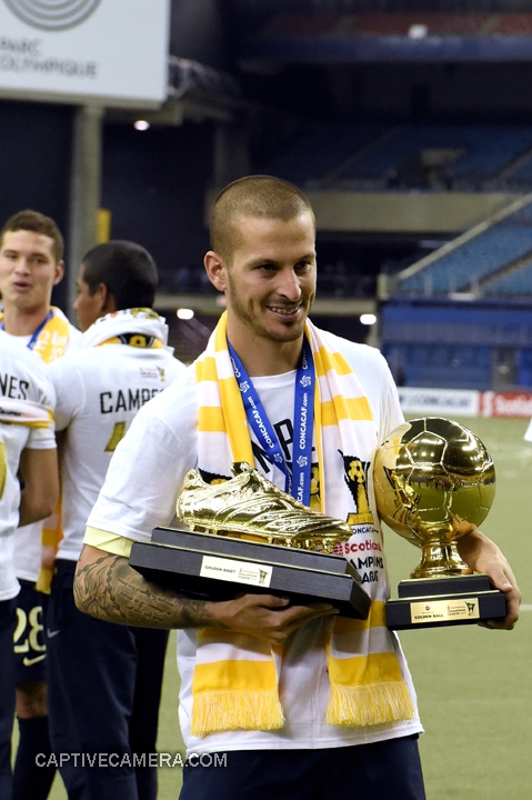   Montreal, Canada - April 29, 2015: Dario Benedetto of Club America displays the tournament Golden Boot and Golden Ball.  