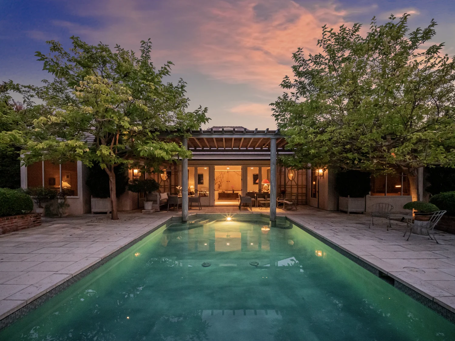 Pool and luxury home at twilight
