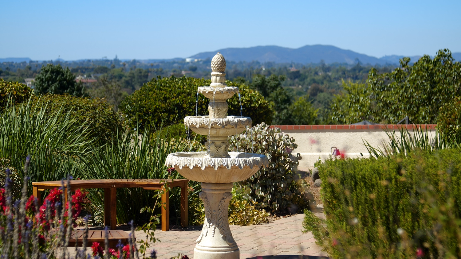 Fountain overlooking a vineyard landscape