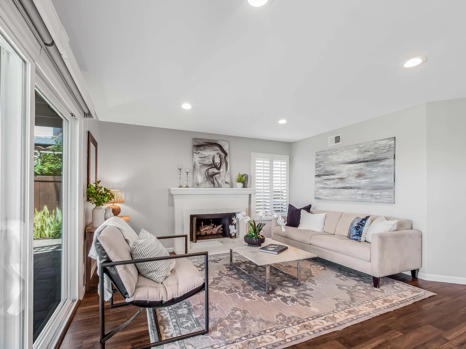 Living room with textured furnishings and garden views
