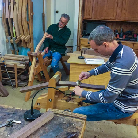 Students shaping legs during a recent arm chair class