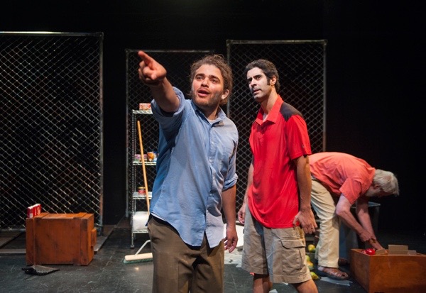   Ali (Abdulrahim Harara, left) speaks to Khoresh (Damien Seperi, center) as Abu Omar (Julian Lopez-Morillas) cleans his store after a bomb goes off outside in Emma Goldman-Sherman’s   Counting in Sha’ab  , directed by Erin Gilley.  