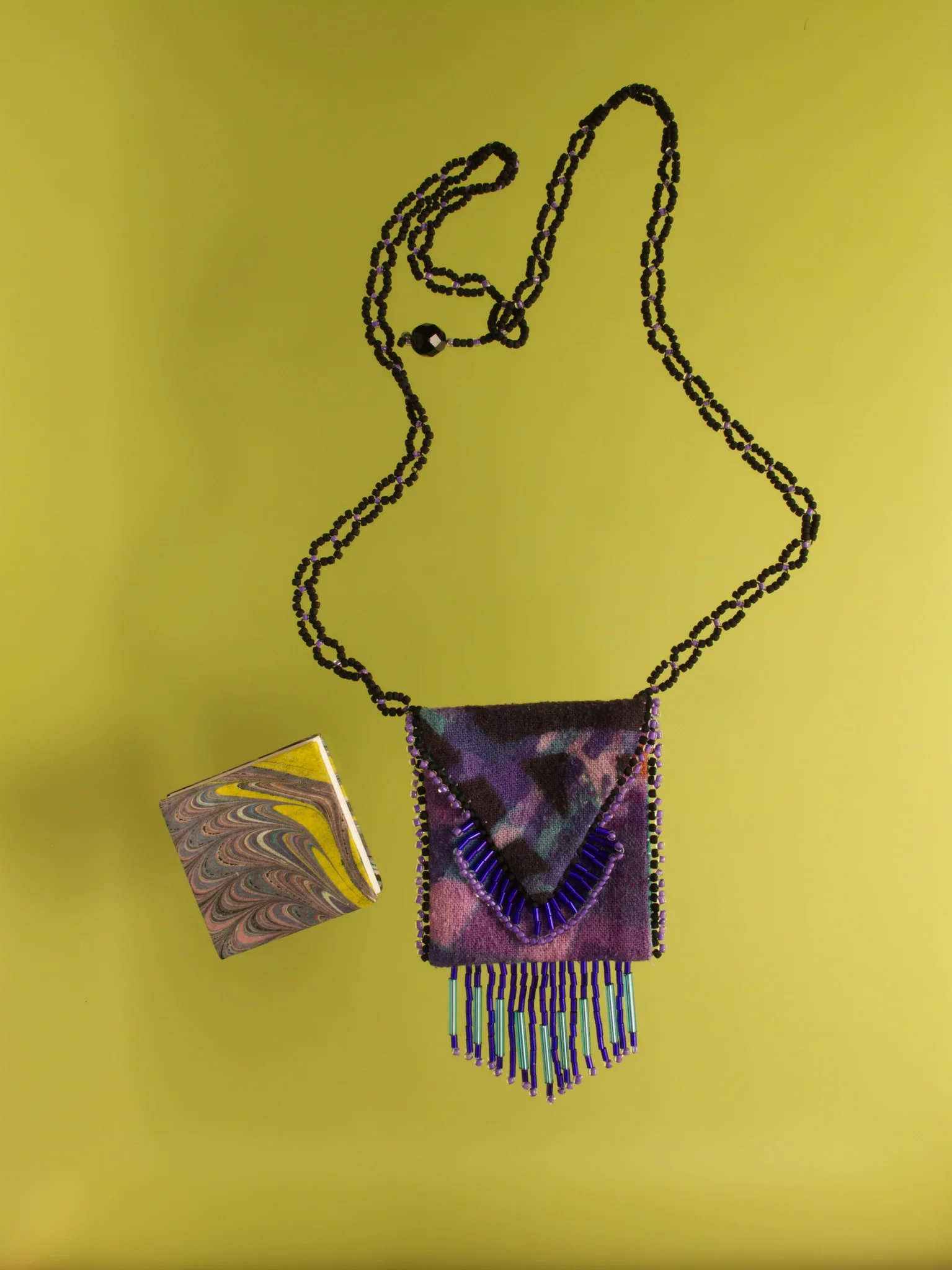 Silk pendant and book