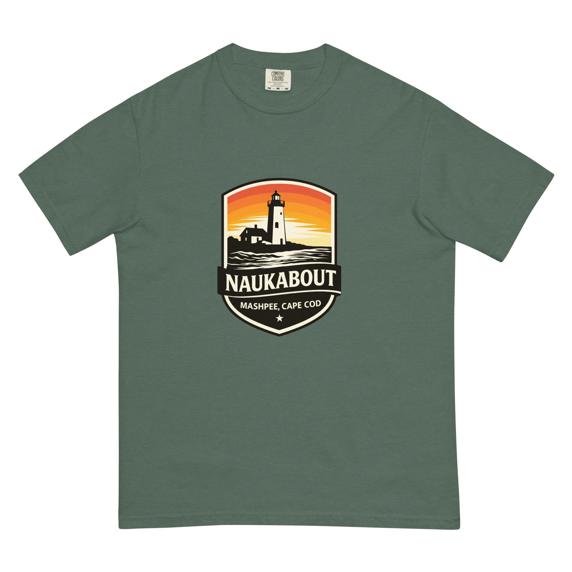 Blue Spruce Naukabout T-shirt with a colorful sunset lighthouse badge centered on the front.