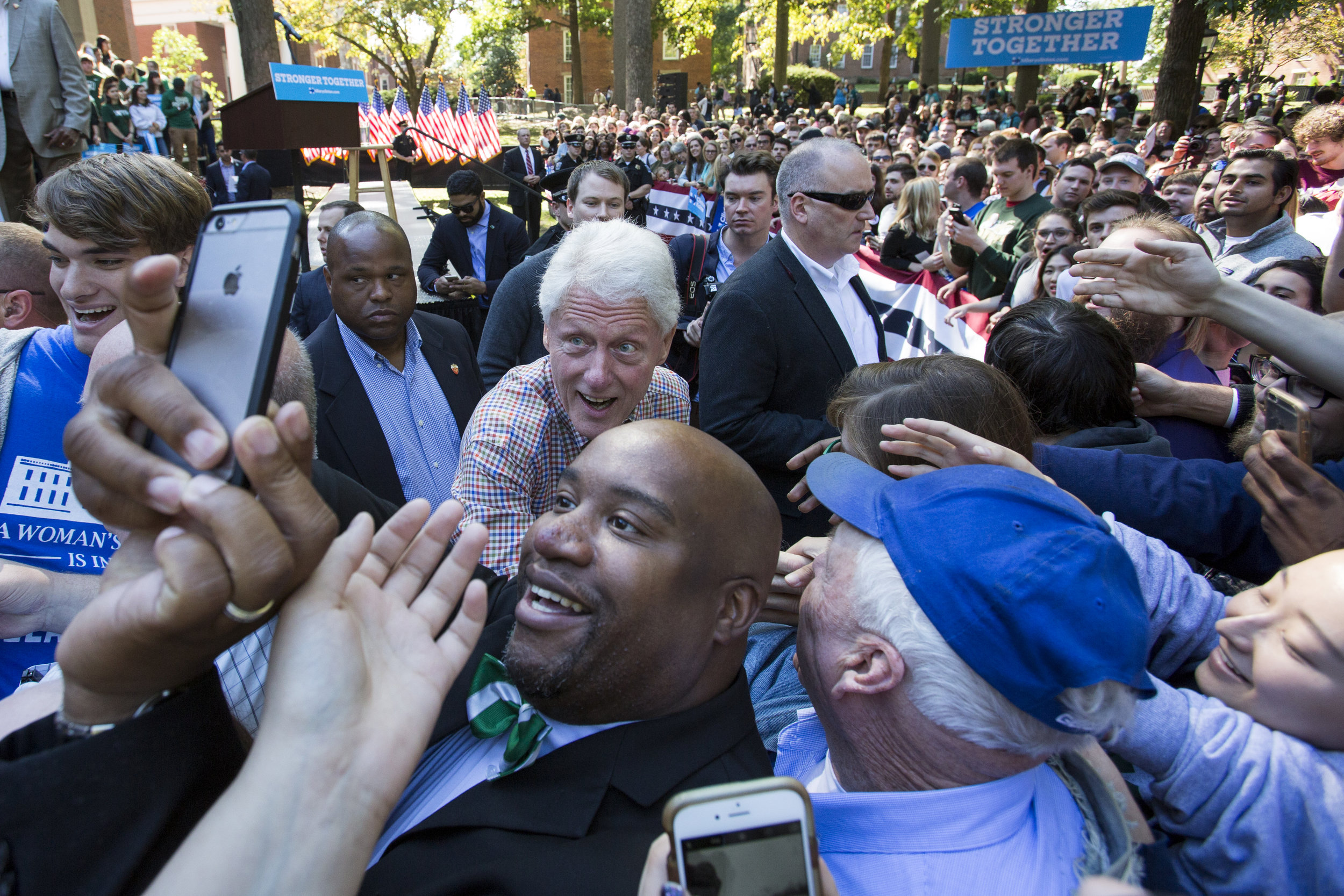   Former president Bill Clinton shakes hands and takes selfies with students and Athens residents after speaking on College Green on October 4, 2016.  