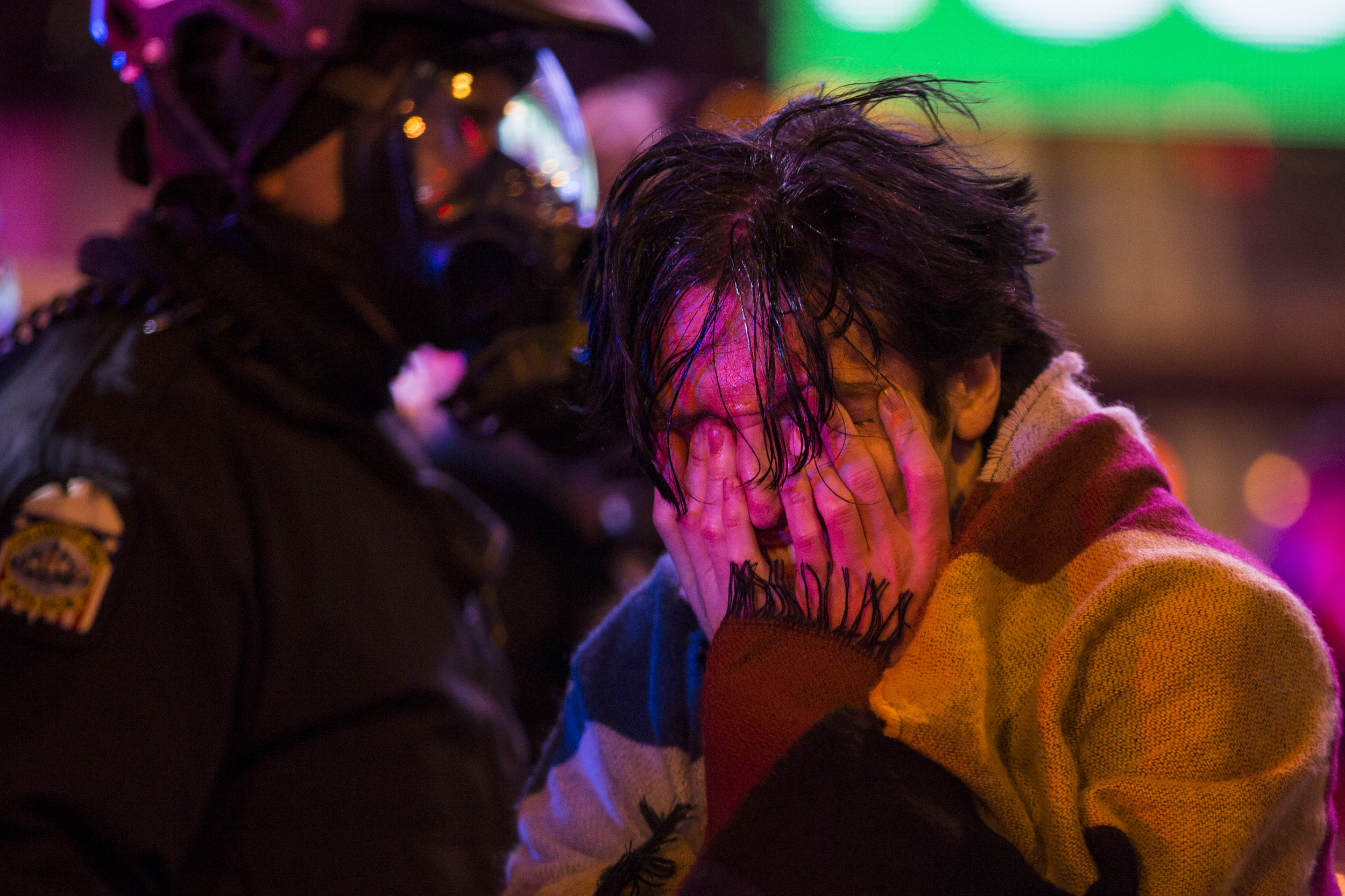  Connor Lefevers rubs his eyes and yells after being pepper sprayed by police for not clearing the streets during a "Resist Trump Rally" in Columbus, Ohio in response to President Trump's executive order on immigration on January 30, 2017. 