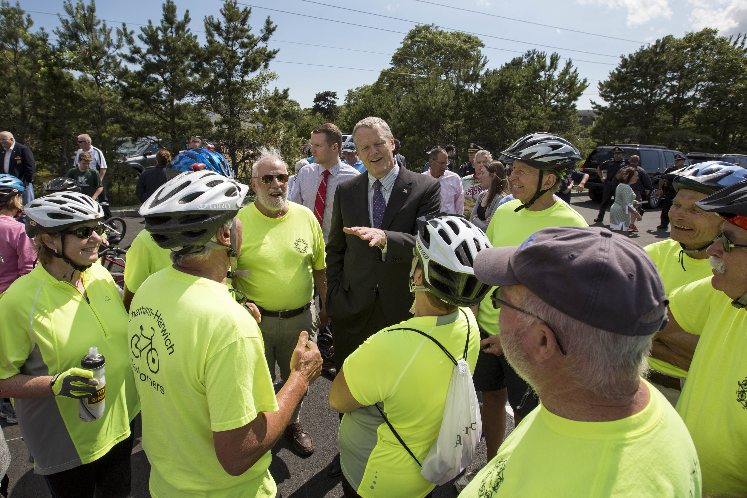  Governor Charlie Baker talks with members of the Chatham-Harwich Newcomers club at the opening of the extension to the Cape Cod Rail Trail in South Dennis off of route 134 on June 28, 2017. 