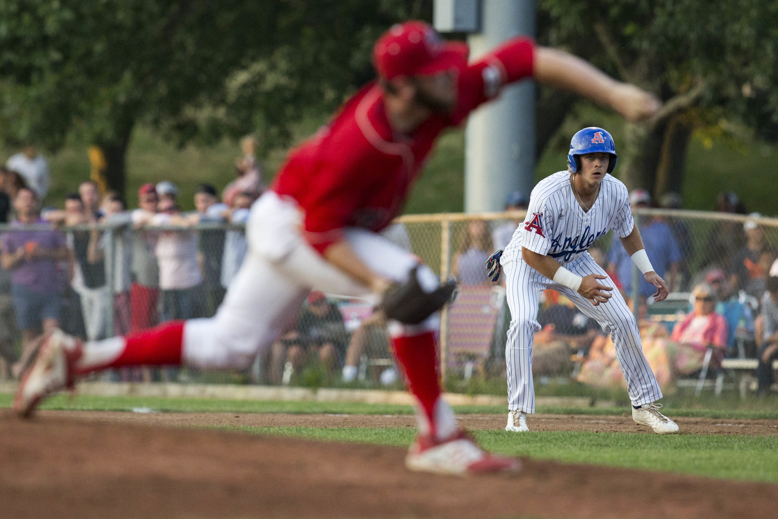  Nick Patten, of the Chatham Anglers, leads off of first base while Hogan Harris, of the Yarmouth-Dennis Red Sox, pitches to Josh Stowers, of the Chatham Anglers, during Chatham's home game against Y-D on July 3, 2017. 