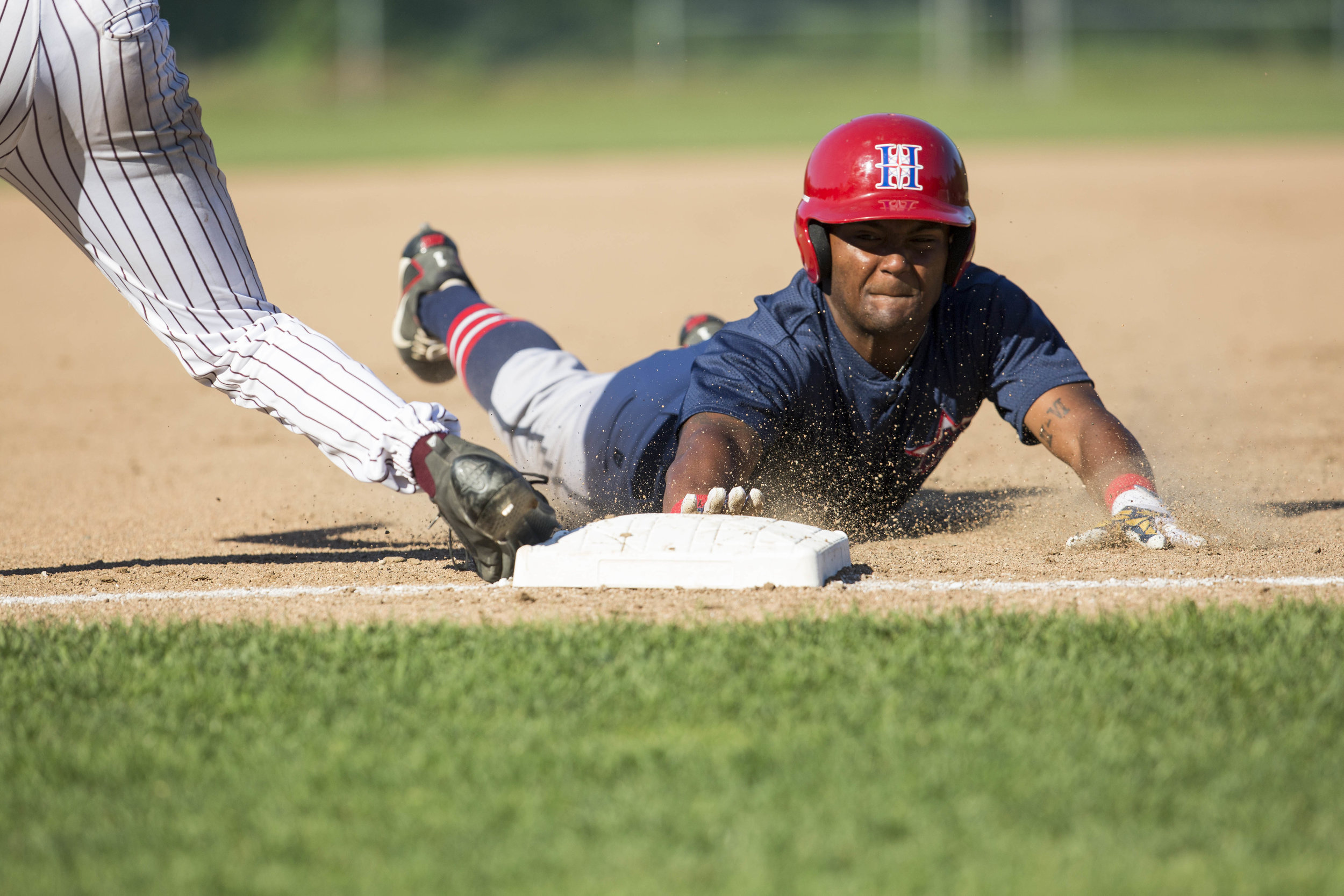  Cobie Vance, of the Harwich Mariners, slides to third base and was called safe during their game against the Cotuit Kettleers on July 9, 2017. 