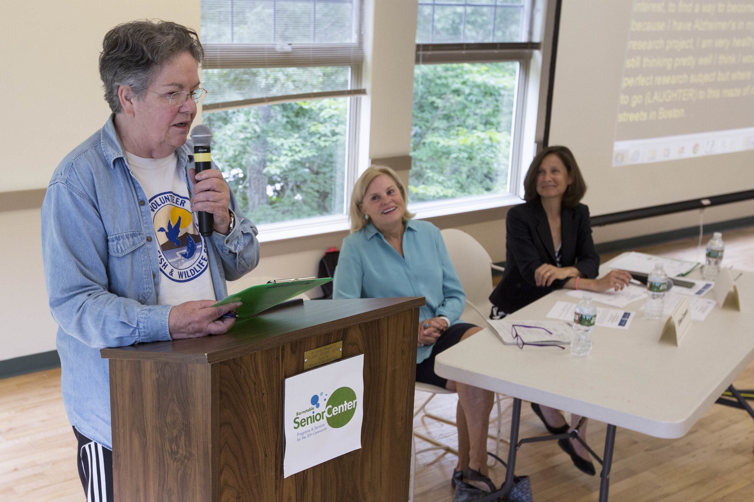  Barbara Waters, a retired science teacher living in Chatham, addresses members of Massachusetts Governor Charlie Baker's staff,&nbsp;Alice Bonner and Eileen Connors, with concerns about the edlerly community on Cape Cod at the Barnstable Senior Cent