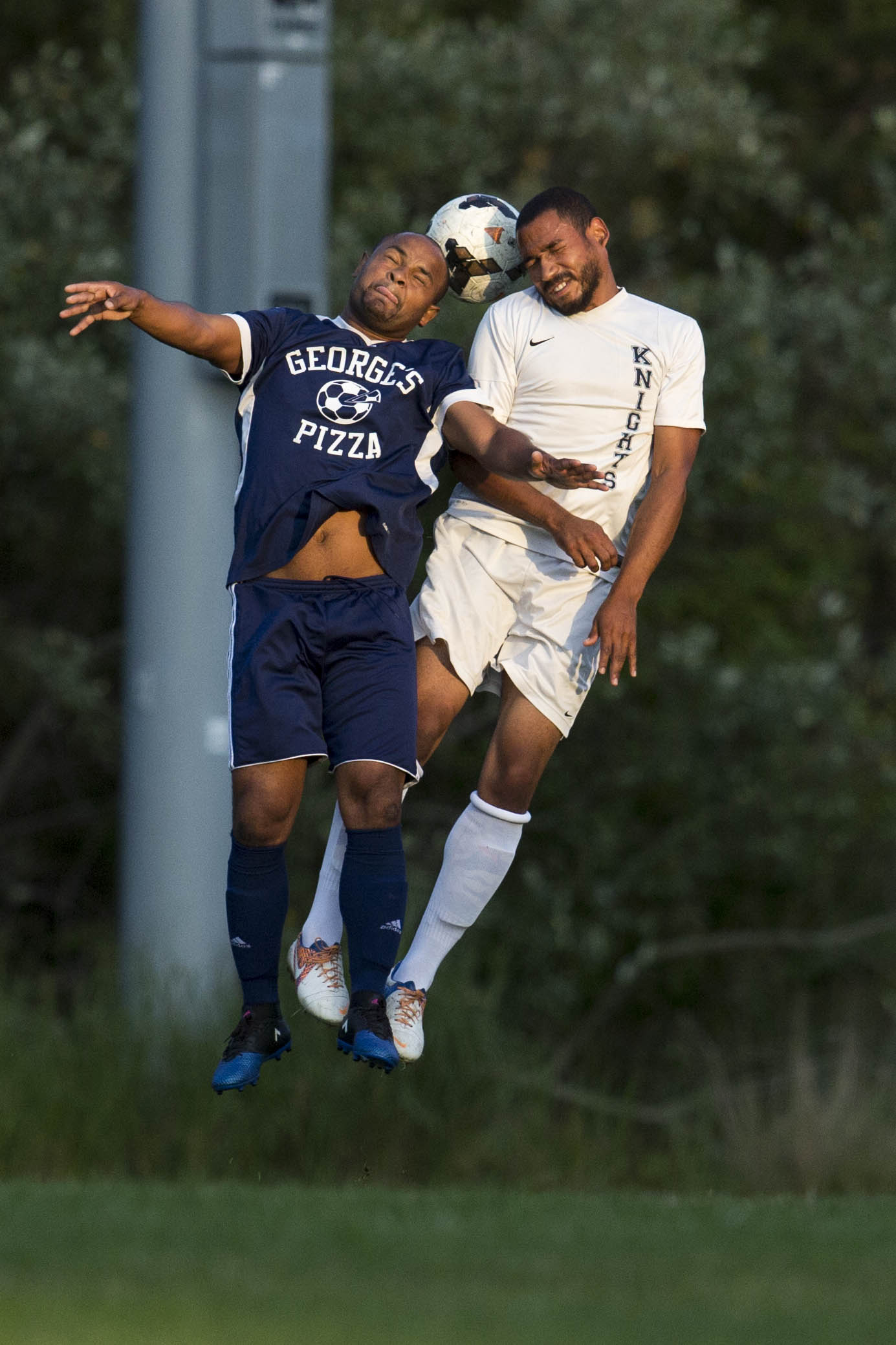  Harwich Blues Helio Coelho and a Sandwich Knights player head the ball during the Cape Cod Amateur Soccer final game on August 6, 2017. 