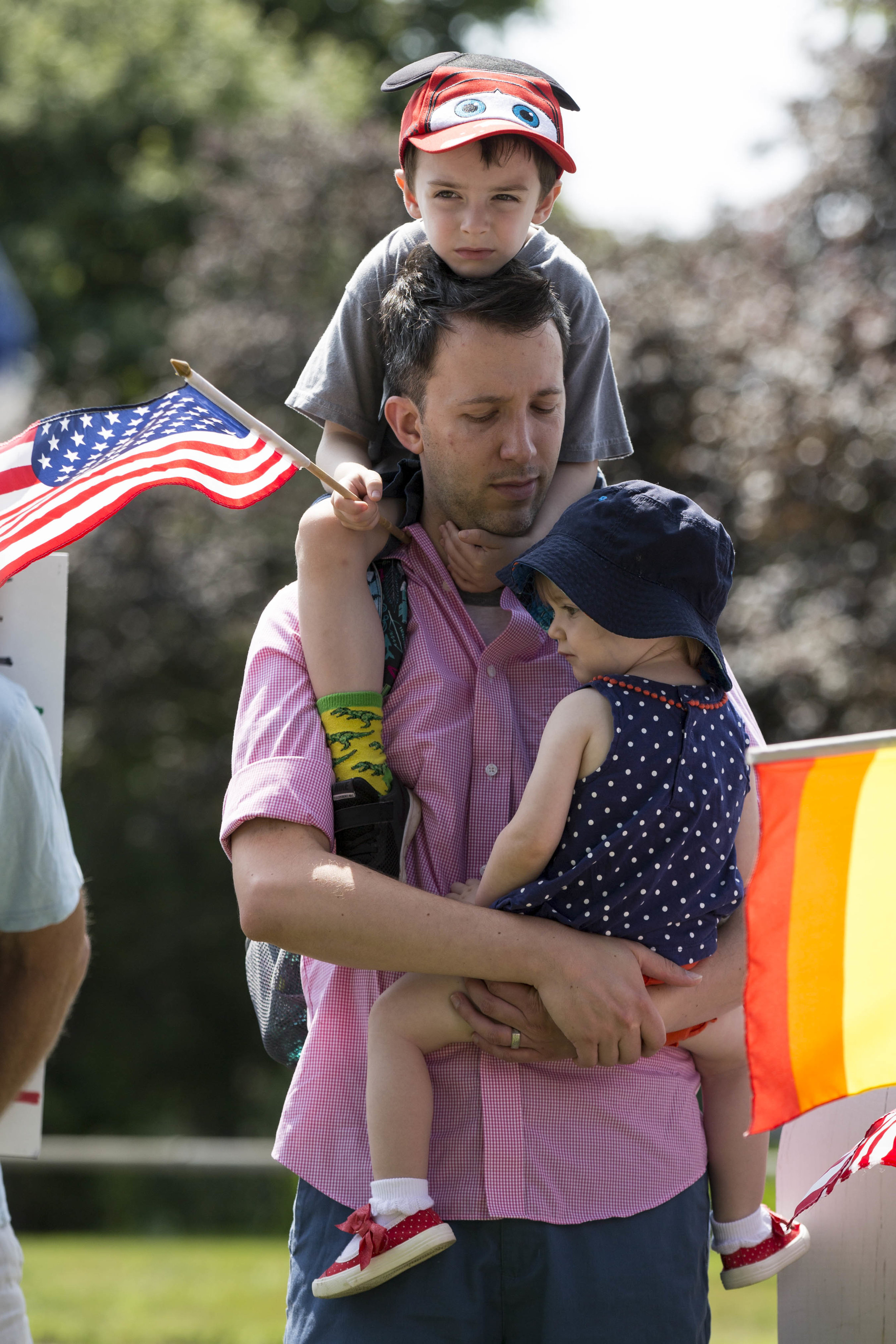  Lucas Skorczeski holds his children Arlo, 5, and Delia, 1, during the Peacekeepers Unite rally in the Falmouth Village Green on August 13, 2017. The rally was held in response to the white nationalist protest in Charlottesville, Virginia that result