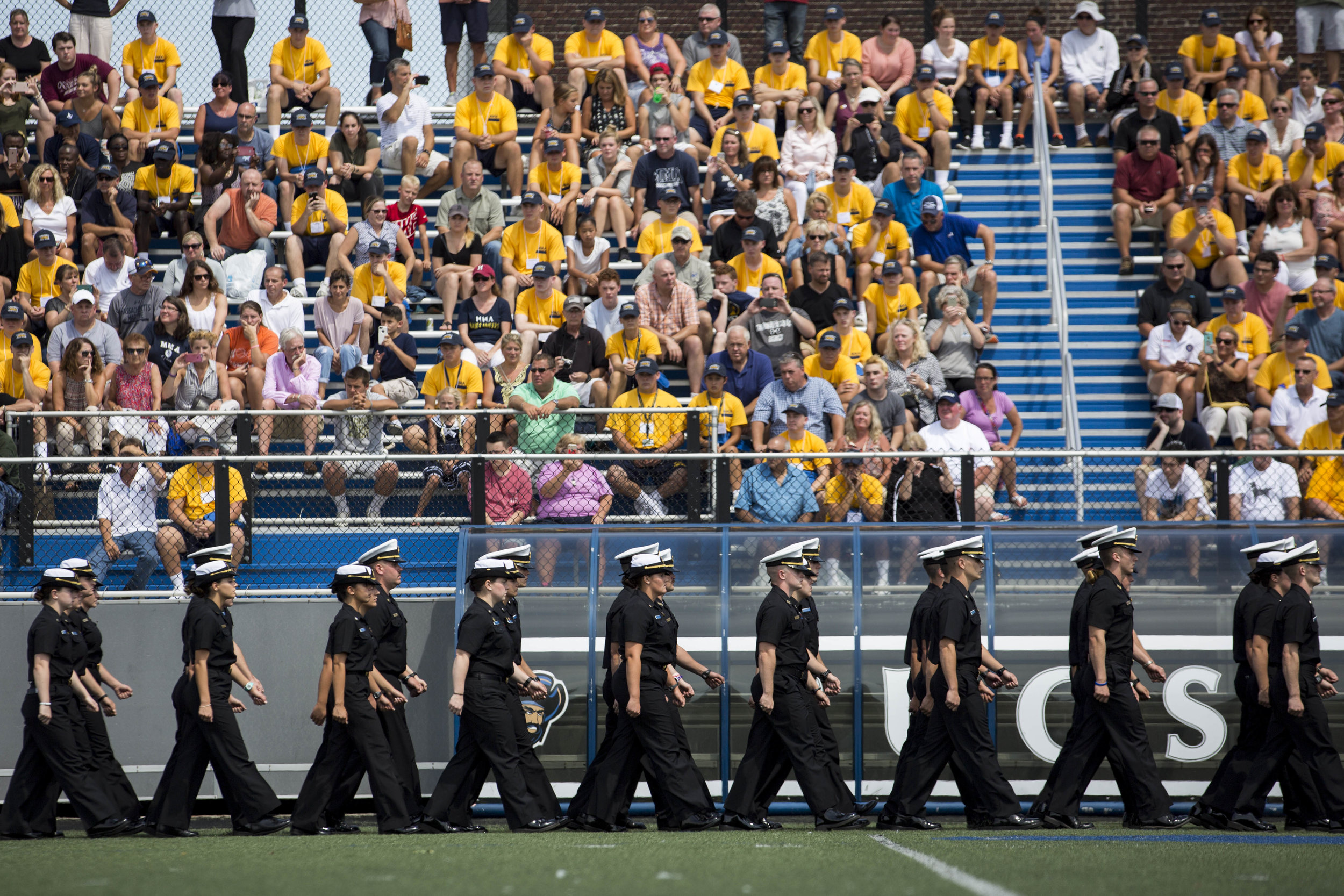  Current Mass Maritime Academy students march on the field during freshman orientation on August 19, 2017. 