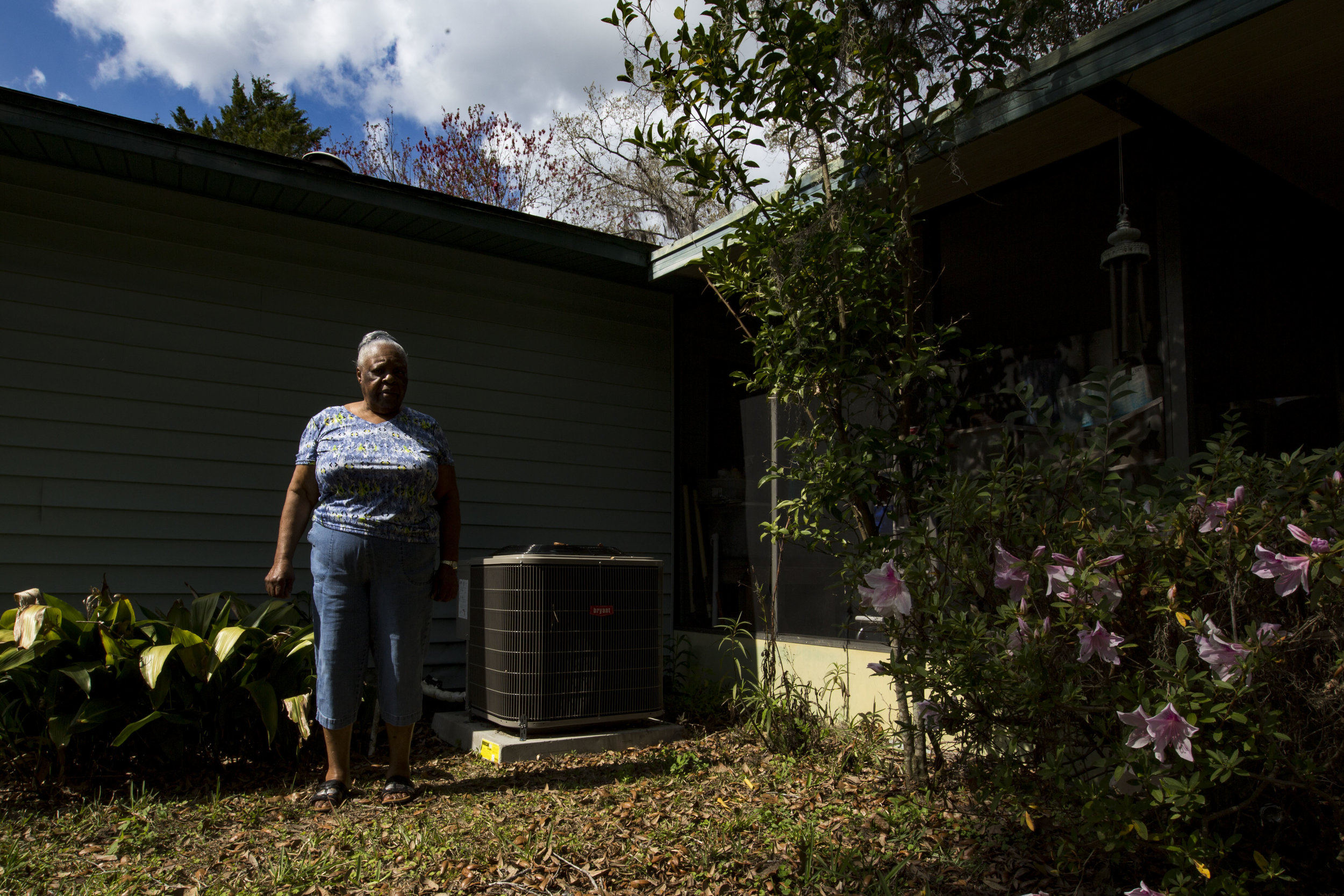  Fannie McCray poses for a portrait in her backyard in front of her new HVAC system on February 20, 2018. McCray was unaware the assessment was going to be attached to her property tax bill and is in jeopardy of losing her home.&nbsp; 