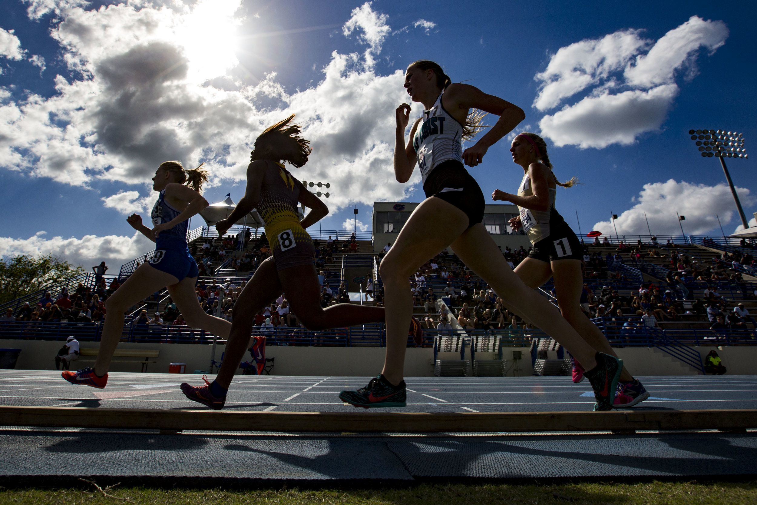  High school girls compete in the 1600 meter run during the Florida Relays at the University of Florida Percy Beard Track on March 29, 2018. 