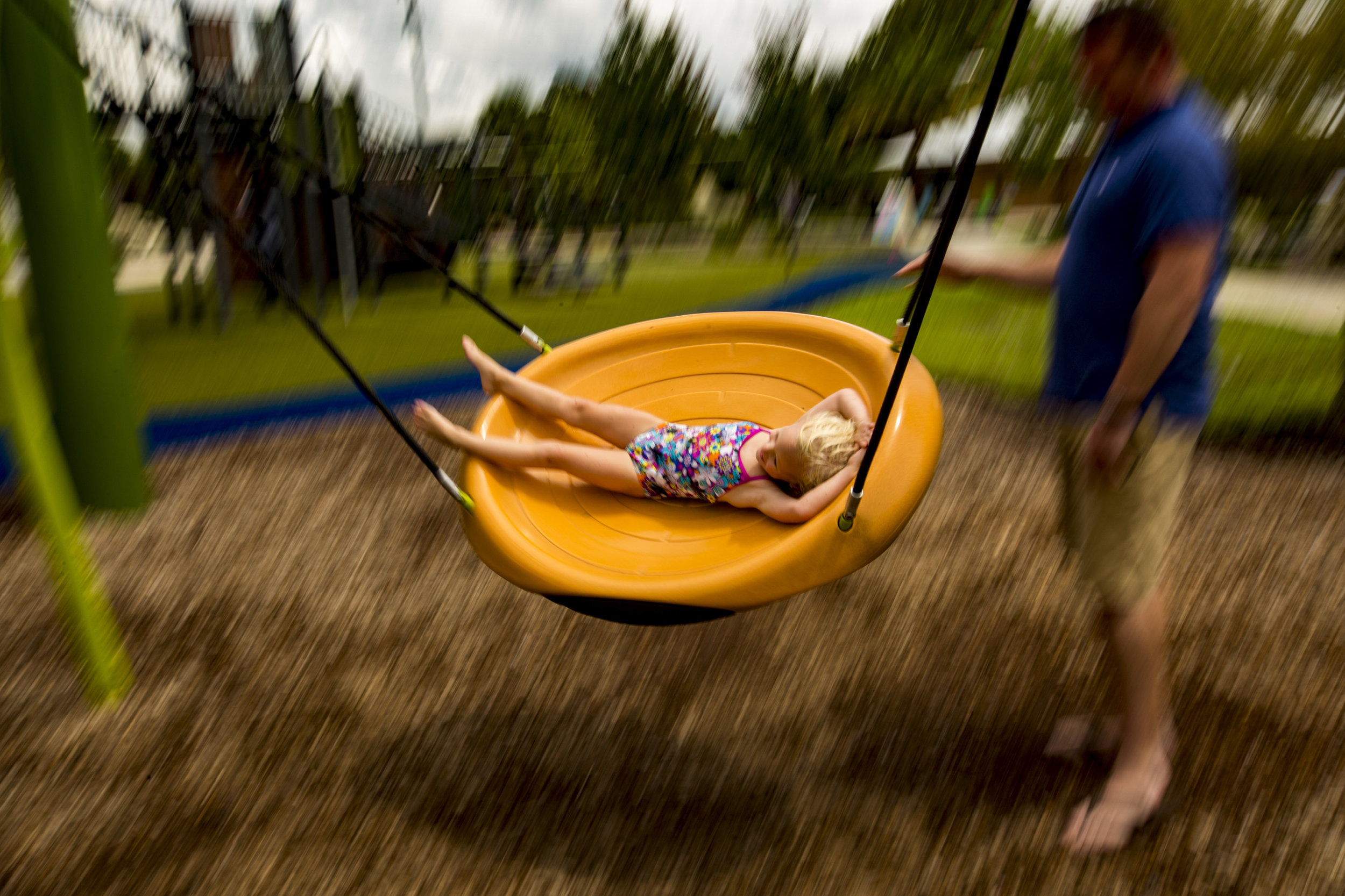  Paul Adamson pushes his daughter Mackenzine, 4, on the swing at Depot Park on Labor Day. 