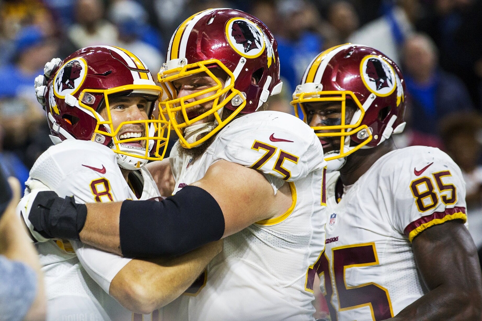  Washington Redskins quarterback Kirk Cousins hugs his teammates after scoring a touchdown during the Redskins vs Lions game at Ford Field on October 23, 2016. 