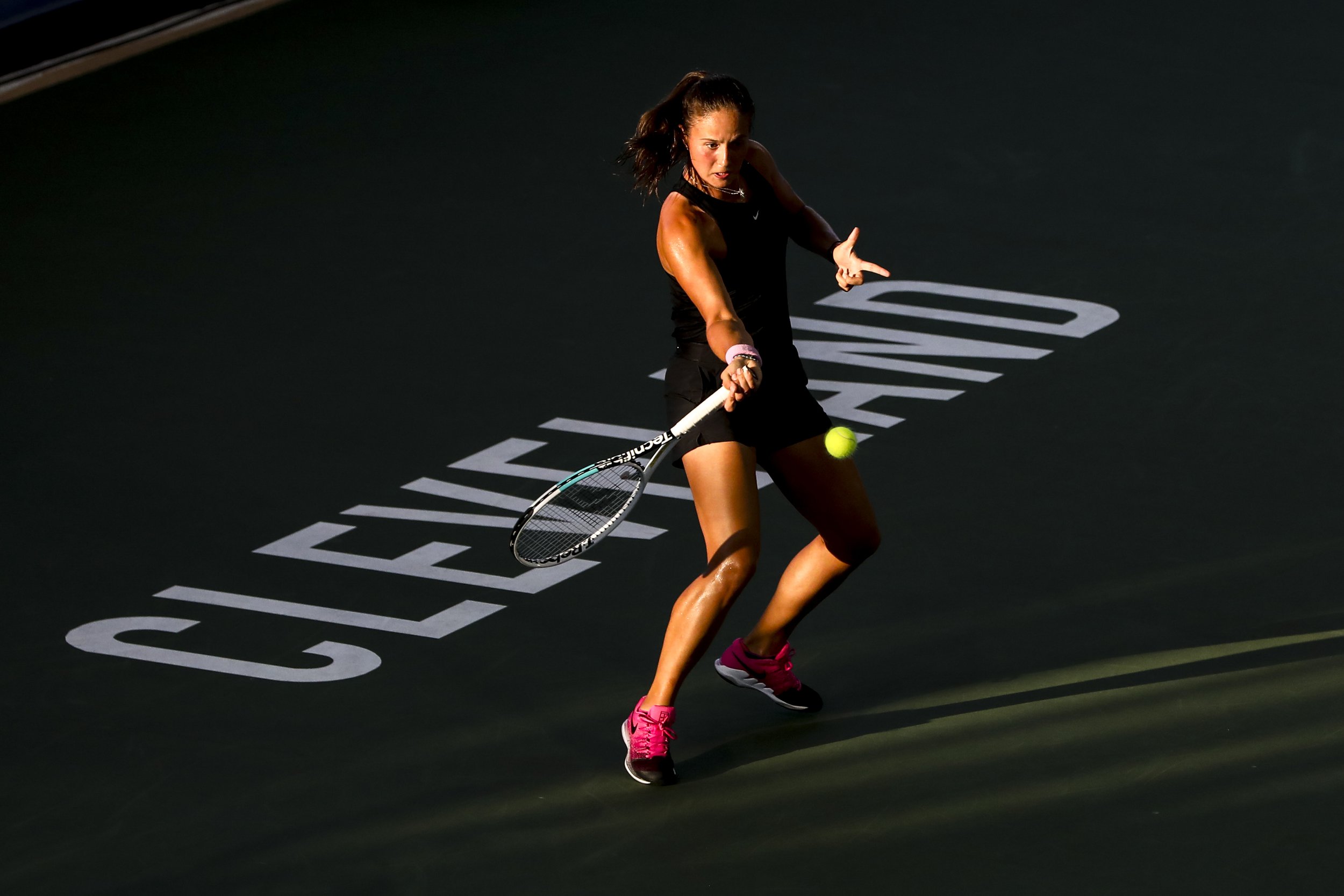  CLEVELAND, OH - AUGUST 24: The sun sets on Daria Kasatkina of Russia as she returns a serve during the second set of her match against Catherine McNally of USA on day 3 of the Cleveland Championships at Jacobs Pavilion on August 24, 2021 in Clevelan