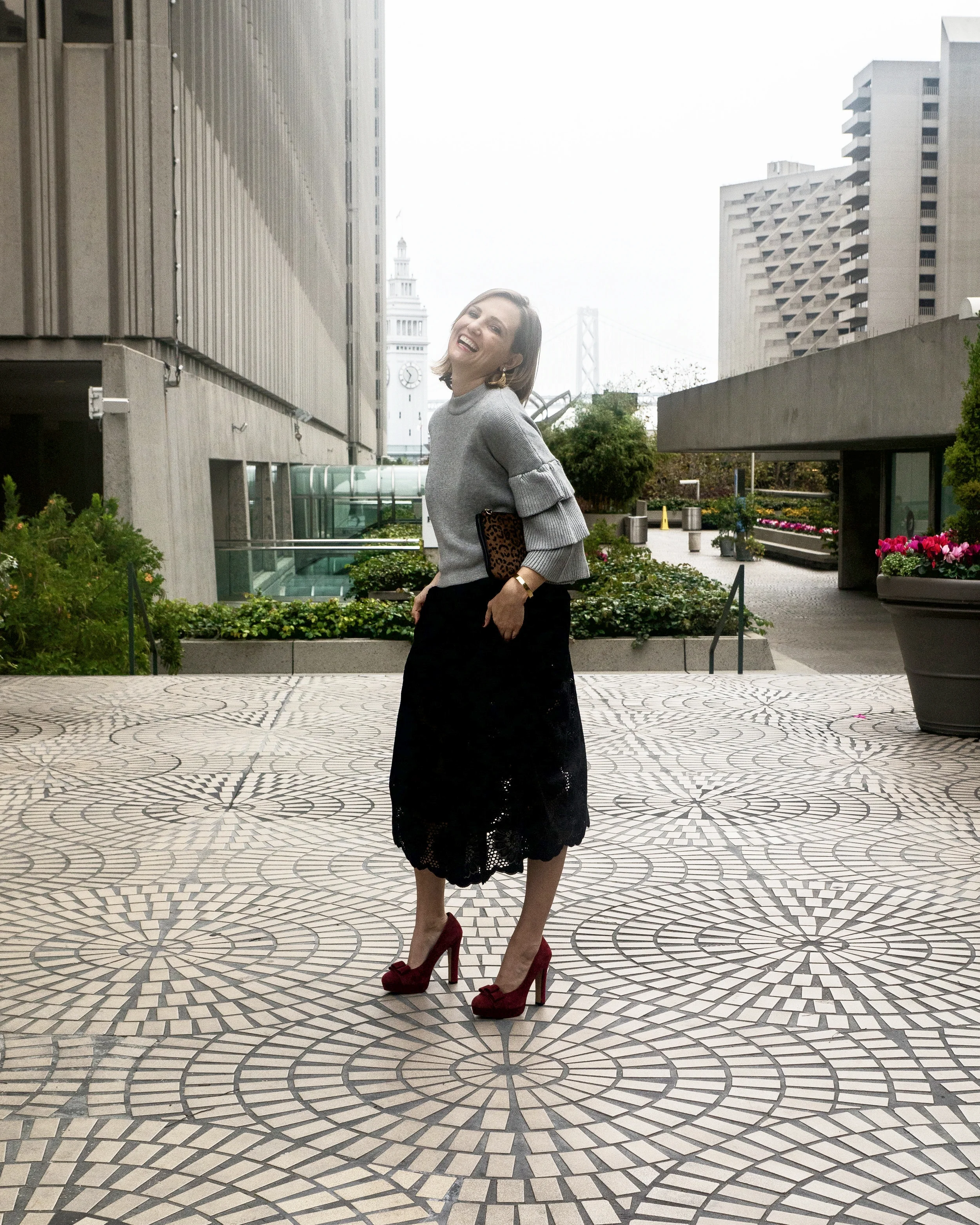 Outfit details: Black crochet dress ( similar here and here ), Endless Rose tiered ruffle sleeve sweater ($78), Maje leopard clutch ( similar here ), Burgundy suede pumps ( similar here ).